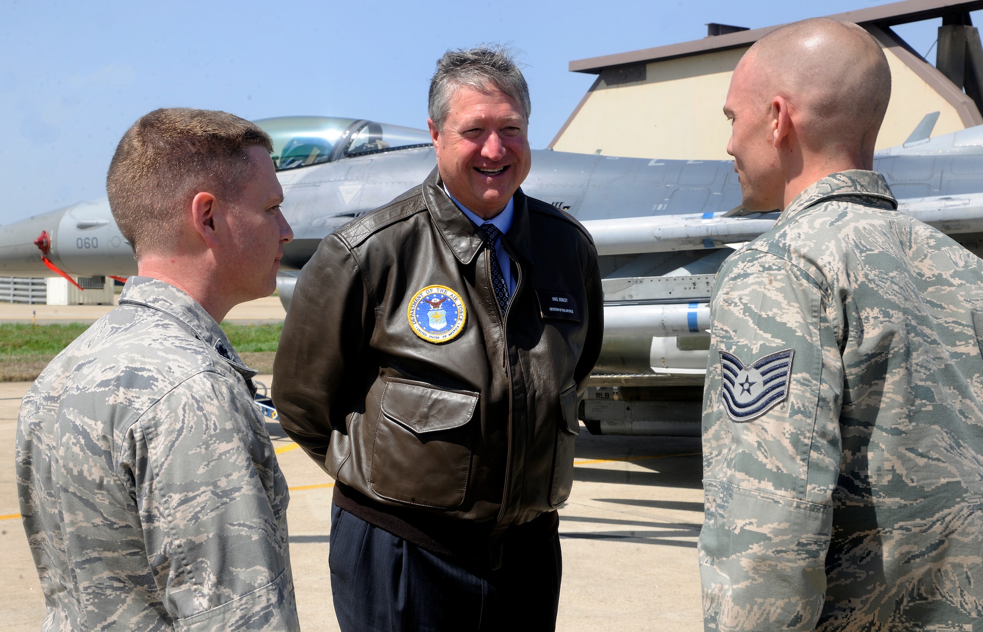 Secretary of the Air Force Michael Donley listens to Lt. Col. Robert Copes, 8th Maintenance Group deputy commander, as he introduces Staff Sgt. Adam Hensen, at Kunsan Air Base, Republic of Korea, April 27, 2012.  During his visit Donley met many Airmen and learned about what they bring to the fight. (U.S. Air Force photo/Staff Sgt Rasheen A. Douglas)