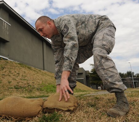 U.S. Air Force Tech. Sgt. Anthony Liebert, 35th Maintenance Squadron avionics production supervisor, forms a bunker with sandbags during Phase 1 of the operational readiness exercise at Misawa Air Base, Japan, April 27, 2012. Phase 1 during an operational readiness exercise evaluates the base’s ability to prepare and deploy personnel, equipment and support assets to a combat environment. (U.S. Air Force photo by Airman Kenna Jackson/Released)