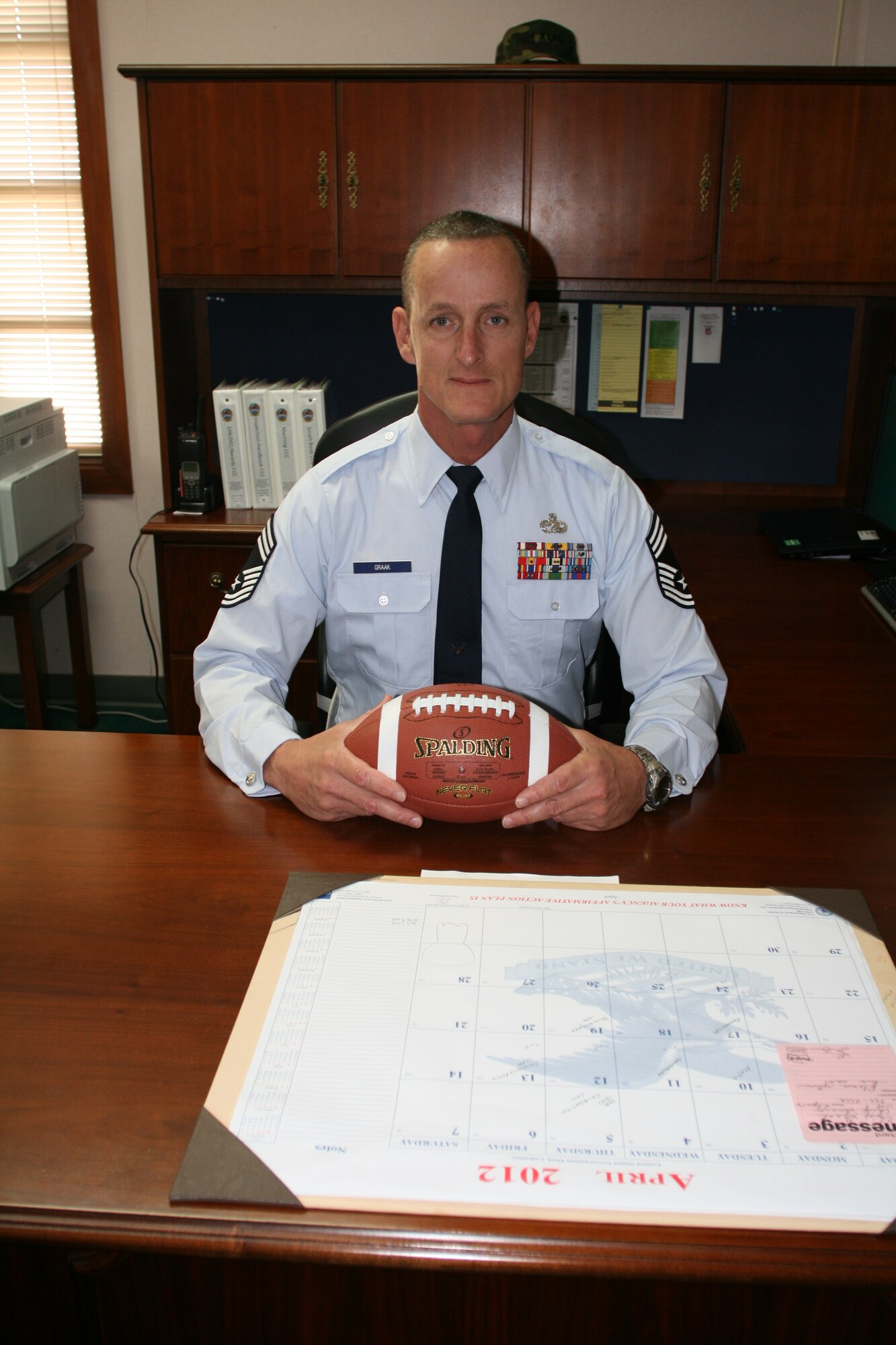 Chief Master Sgt. David Graak, 734th Air Mobility Squadron, enjoys football and other sports activities as a part of maintaining a healthy lifestyle. (U.S. Air Force photo by Staff Sgt. Anthony Miller)