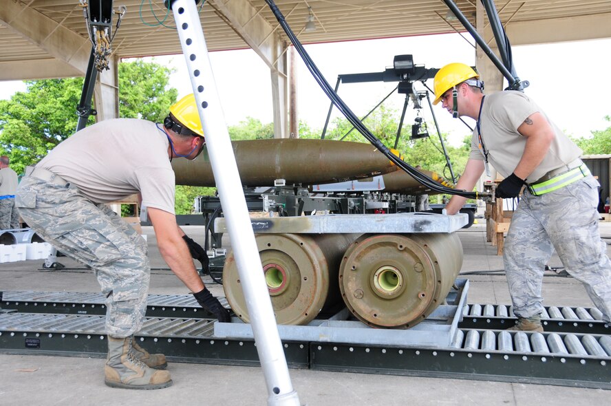 ANDERSEN AIR FORCE BASE, Guam- Airman from the 36th Munitions Squadron builds a Mark 84 bomb during the Combat Ammunition Production Exercise April 24.  CAPEX tests the 36 MUNS munitions production capabilities under possible real world scenarios. (U.S. Air Force photo by Senior Airman Jeffrey Schultze)  