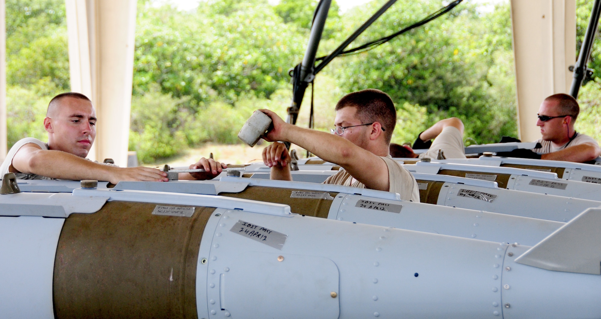 ANDERSEN AIR FORCE BASE, Guam- Airmen from the 36th Munitions Squadron build Mark 84 bombs during the Combat Ammunition Production Exercise April 24. CAPEX tests the 36 MUNS munitions production capabilities under possible real world scenarios. (U.S. Air Force photo by Senior Airman Jeffrey Schultze)  