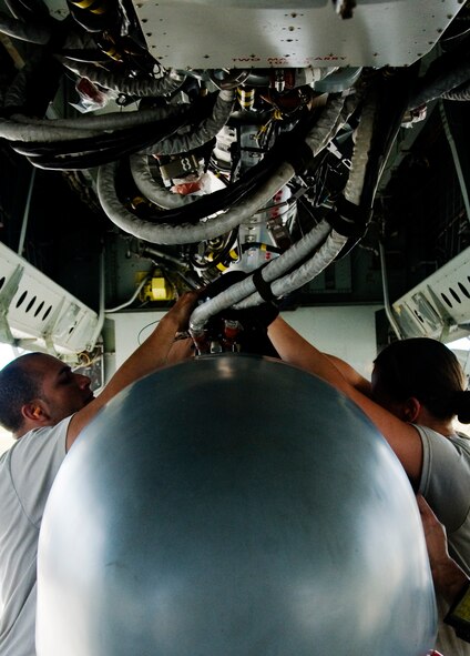 ANDERSEN AIR FORCE BASE, Guam –Airmen from the 36th Expeditionary Aircraft Maintenance Squadron,  upload a training Conventional Air-Launched Cruise Missile during the Combat Ammunition Production Exercise, Andersen Air Force Base, Guam, April 23, 2012. During the CAPEX approximately 21 inspectors will evaluate the processes and procedures for building munitions to support the wing’s operational plan. (U.S. Air Force photo by Staff Sgt. Alexandre Montes)