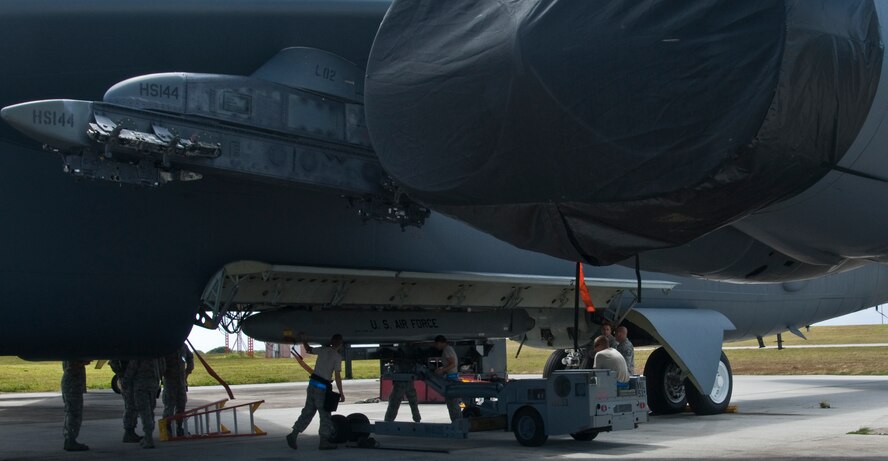 ANDERSEN AIR FORCE BASE, Guam –Airmen from the 36th Expeditionary Aircraft Maintenance Squadron,  upload a training Conventional Air-Launched Cruise Missile to a B-52 Stratofortress during the Combat Ammunition Production Exercise, Andersen Air Force Base, Guam, April 23, 2012. During the CAPEX approximately 21 inspectors will evaluate the processes and procedures for building munitions to support the wing’s operational plan. (U.S. Air Force photo by Staff Sgt. Alexandre Montes)