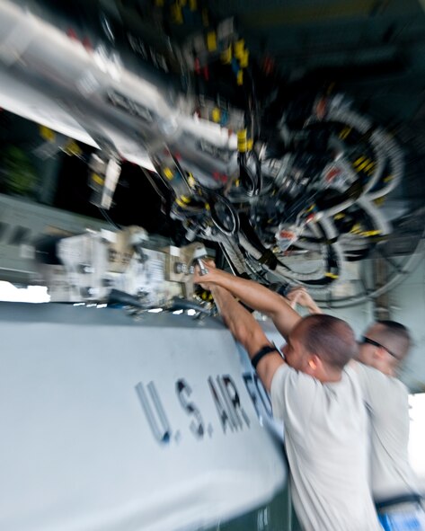 ANDERSEN AIR FORCE BASE, Guam –Airmen from the 36th Expeditionary Aircraft Maintenance Squadron,  upload a training Conventional Air-Launched Cruise Missile during the Combat Ammunition Production Exercise, Andersen Air Force Base, Guam, April 23, 2012. During the CAPEX approximately 21 inspectors will evaluate the processes and procedures for building munitions to support the wing’s operational plan. (U.S. Air Force photo by Staff Sgt. Alexandre Montes)