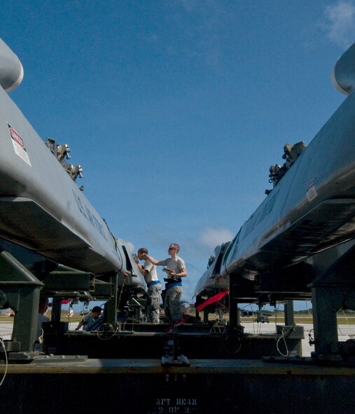 ANDERSEN AIR FORCE BASE, Guam –Airmen Deployed to the 36th Expeditionary Aircraft Maintenance Squadron prepare to lift and transport a training Conventional Air-Launched Cruise Missile during the Combat Ammunition Production Exercise April 23. During the CAPEX approximately 21 inspectors will evaluate the processes and procedures for building munitions to support the wing’s operational plan. (U.S. Air Force photo by Staff Sgt. Alexandre Montes)