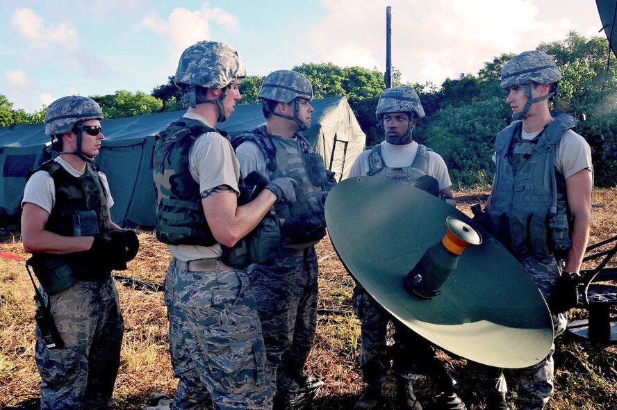 ANDERSEN AIR FORCE BASE, Guam--The 644th Combat Communications Squadron Airmen set up a satellite dish that allows the team to be current with the latest world events during Exercise Dragon Thunder April 21. Satellite transmission is the main source of communication and information in a deployed environment. (U.S. Air Force photo by Airman 1st Class Marianique Santos)