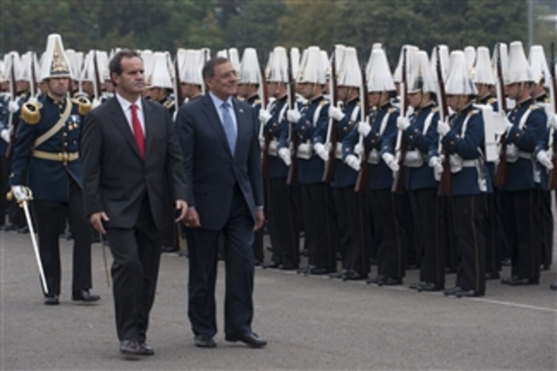 Chilean Minister of National Defense Andres Allamand and Secretary of Defense Leon E. Panetta review Chilean troops during a welcoming ceremony for Panetta in Santiago, Chile, April 26, 2012.  Panetta is on a five-day trip to the region to meet with counterparts and military officials in Brazil, Colombia and Chile to discuss an expansion of defense and security cooperation.  