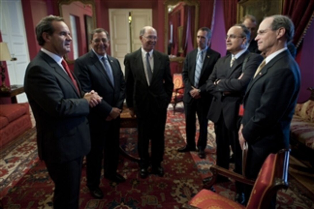 Chilean Minister of National Defense Andres Allamand, left, speaks with Secretary of Defense Leon E. Panetta, U.S. Ambassador to Chile Alex Wolff and members of Panetta's traveling staff prior to a meeting at the Presidential Palace, Santiago, Chile, April 26, 2012.  Panetta is on a five-day trip to the region to meet with counterparts and military officials in Brazil, Colombia and Chile to discuss an expansion of defense and security cooperation.  