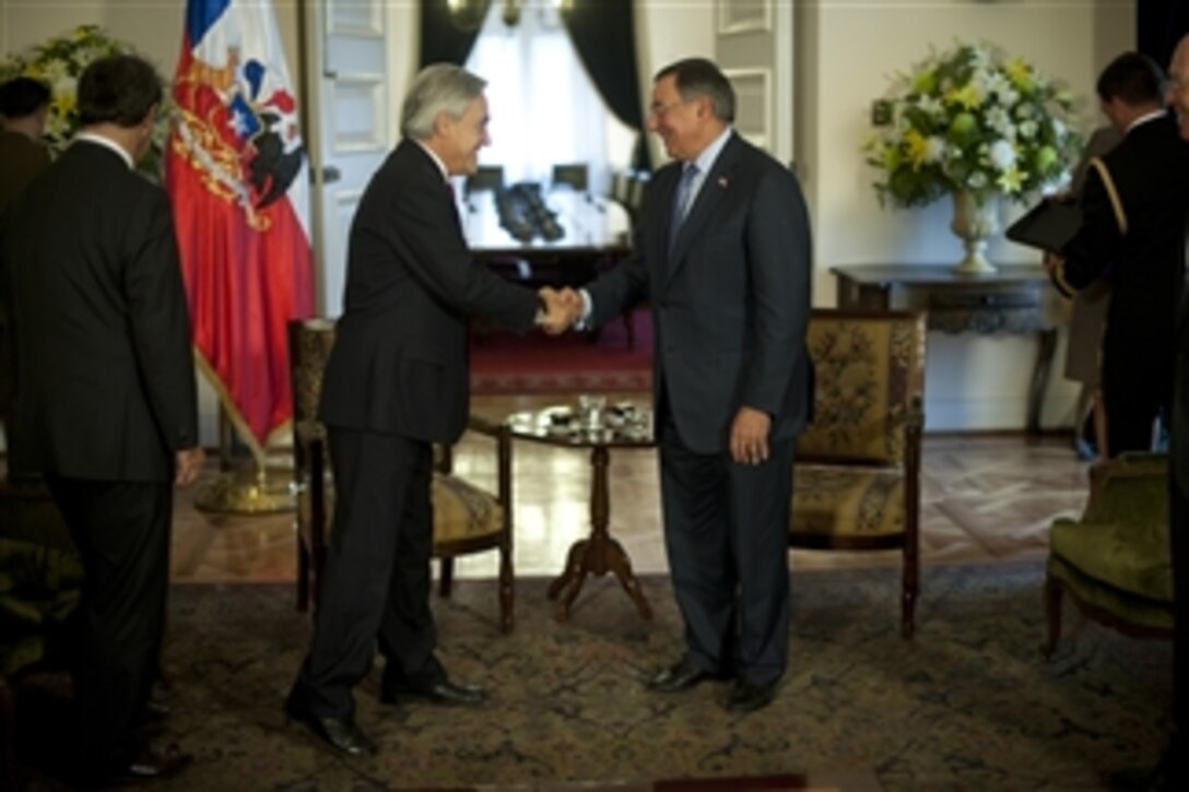 Secretary of Defense Leon E. Panetta greets Chilean President Sebastian Pinera at the Presidential Palace, Santiago, Chile, April 26, 2012.  Panetta is on a five-day trip to the region to meet with counterparts and military officials in Brazil, Colombia and Chile to discuss an expansion of defense and security cooperation.  