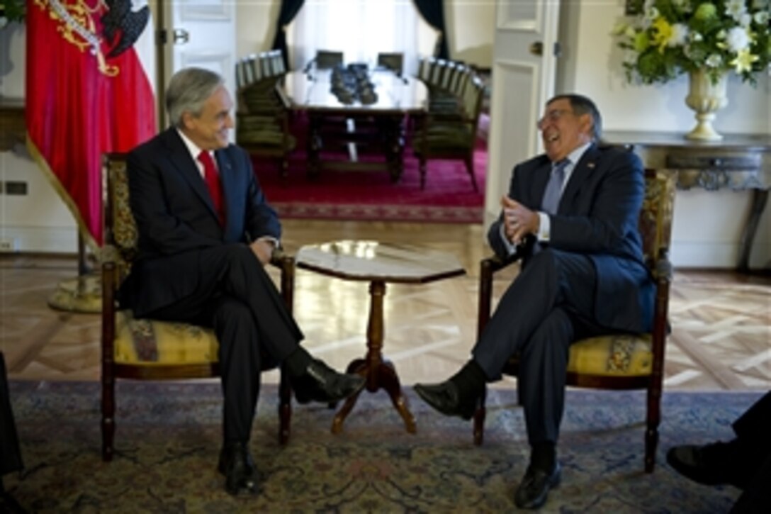 Secretary of Defense Leon E. Panetta shares a lighter moment with Chilean President Sebastian Pinera at the Presidential Palace, Santiago, Chile, April 26, 2012.  Panetta is on a five-day trip to the region to meet with counterparts and military officials in Brazil, Colombia and Chile to discuss an expansion of defense and security cooperation.  
