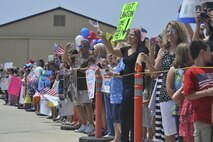 SHAW AIR FORCE BASE, S.C. - Family and friends wait outside Hangar 1200 on Shaw Air Force Base, S.C. as U.S. Air Force members from the 79th Fighter Squadron and the Tiger Aircraft Maintenance Unit return home after a seven month deployment. The 79th FS flew the last two combat Air Force aircraft over Iraq while providing top cover for the last convoys leaving the country.  (U.S.  Air Force photo by Master Sgt. Cohen A. Young/Released)
