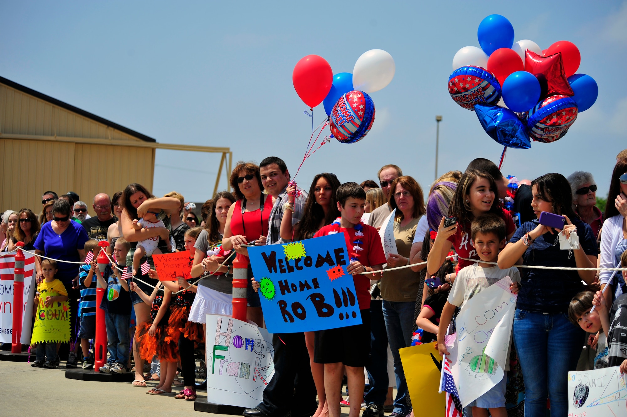 Friends and families of the 79th Fighter Squadron and Tiger Maintenance Unit Airmen wait on the flightline for their loved ones to step out of their plane after returning from a seven-month deployment at Shaw Air Force Base, S.C., April 28, 2012. The 79th Fighter Squadron flew the last two combat Air Force aircraft over Iraq providing top cover for the last convoys leaving the country. (U.S. Air Force photo by Senior Airman Daniel Phelps/Released)