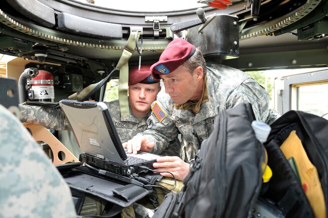 U.S. Army Sgt. 1st Class Bruce Dyson and Sgt. 1st Class Eric Huntsman of the 19th Special Forces, Utah National Guard, set up satellite communication in support of the Great Utah Shakeout earthquake drill April 17, 2012, in Salt Lake City, Utah.  (U.S. Air Force Photo by Tech. Sgt. Jeremy Giacoletto-Stegall/Released)