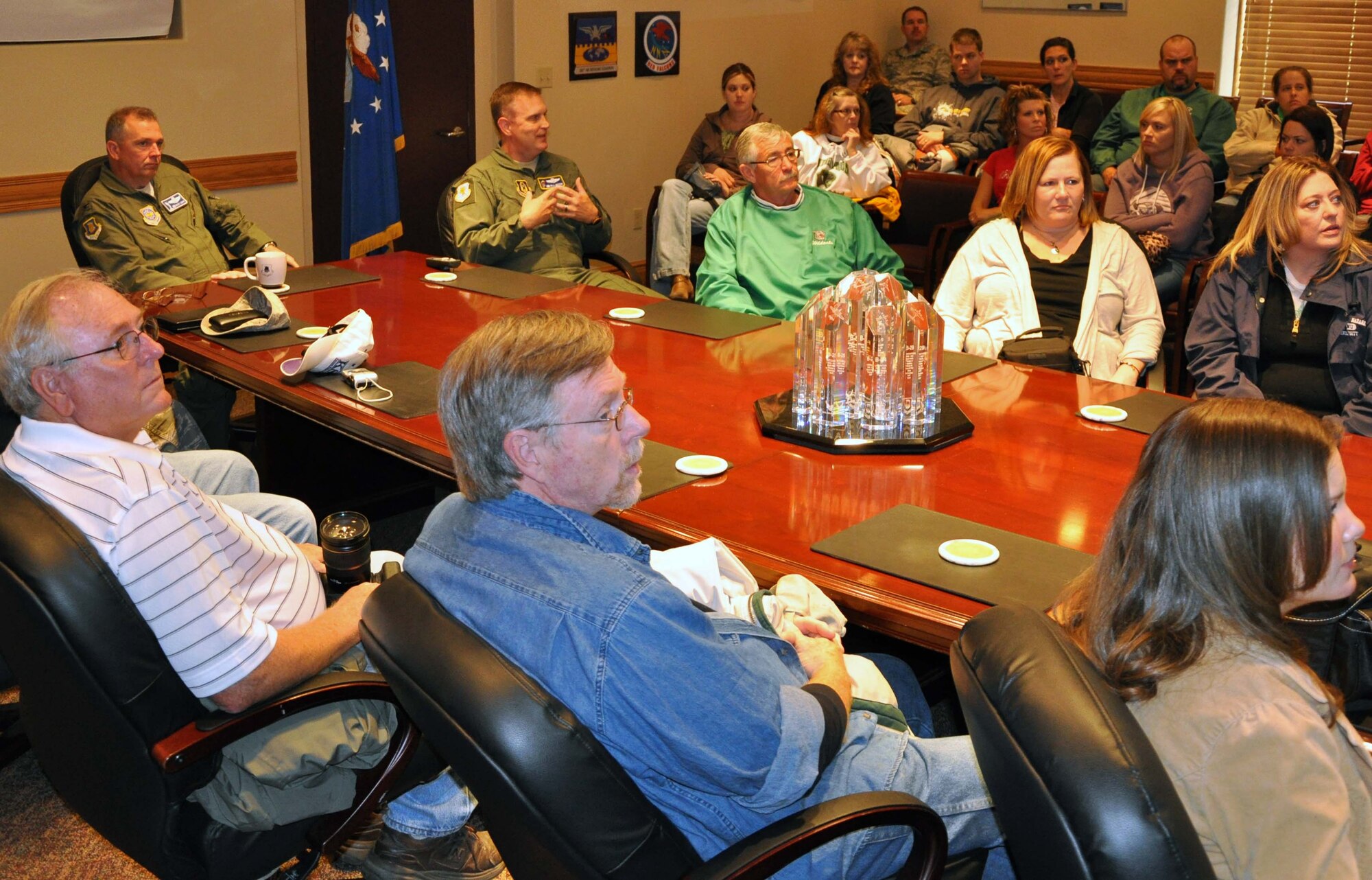 Col. Ricky N. Rupp, commander, 22nd Air Refueling Wing, McConnell Air Force Base, Kan., looks on as Col. William H. Mason, commander, 931st Air Refueling Group, presents a unit mission brief to a group of educators from Wichita area schools.  The commanders briefed the educators on the refueling mission at McConnell, and discussed how the Reserve and active duty components at the base work together as a total force.  The 32 local educators were on base to participate in an orientation flight, hosted by the 22nd Air Refueling Wing.  (U.S. Air Force photo by 1st Lt. Zach Anderson) 
