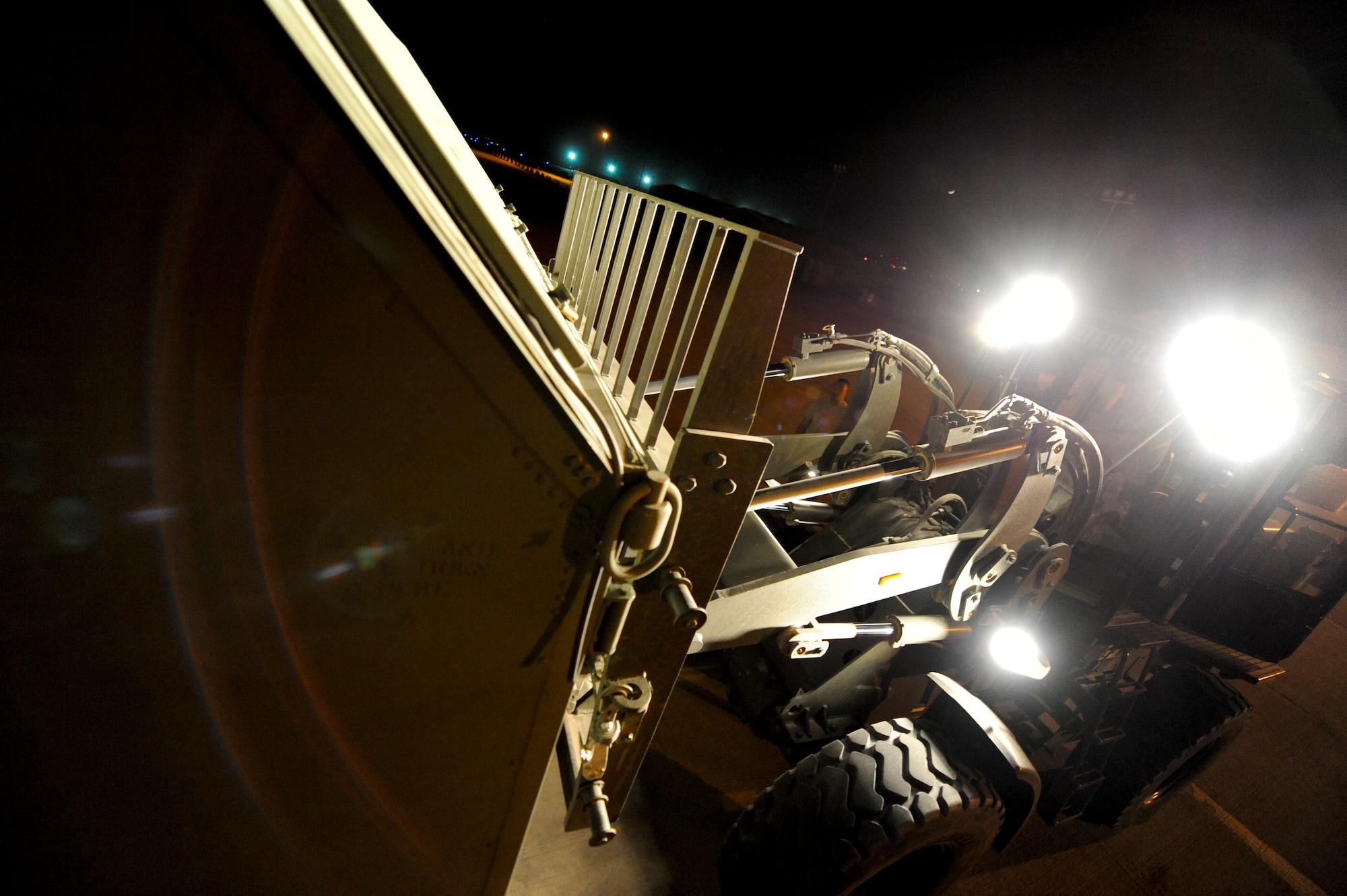 SOUTHWEST ASIA -- A 332nd Expeditionary Logistics Readiness Squadron forklift operator places cargo onto a truck bed here, April 25, 2012. The cargo was convoyed to a staging facility in order for it to be shipped to the United States. (U.S. Air Force photo by Staff Sgt. Joshua J. Garcia)