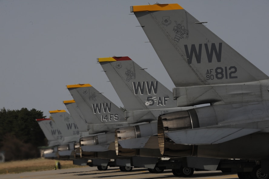 Six F-16 Fighting Falcon aircraft are seen lined up across the runway at Misawa Air Base, Japan during an operational readiness exercise April 28, 2012. During Phase 1 of the exercise, pilots and flightline maintainers assigned to the 35th Fighter Wing simulated launching several jets to show how the wing can quickly deploy war-fighting assets. (U.S. Air Force photo/Airman Kenna Jackson)