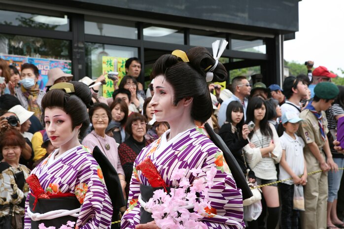 Two station residents, dressed as lady followers, walk in the final gala across the Kintai Bridge and through Kintai park April 29, 2012 as part of the Sankin-kotai, the Daimyo's annual March through Edo. During the age of Feudal Japan, each Daimyo (Japanese feudal lord) was required by the Tokugawa Shogunate to reprt at least every other year in the capital city of Edo, now Tokyo.