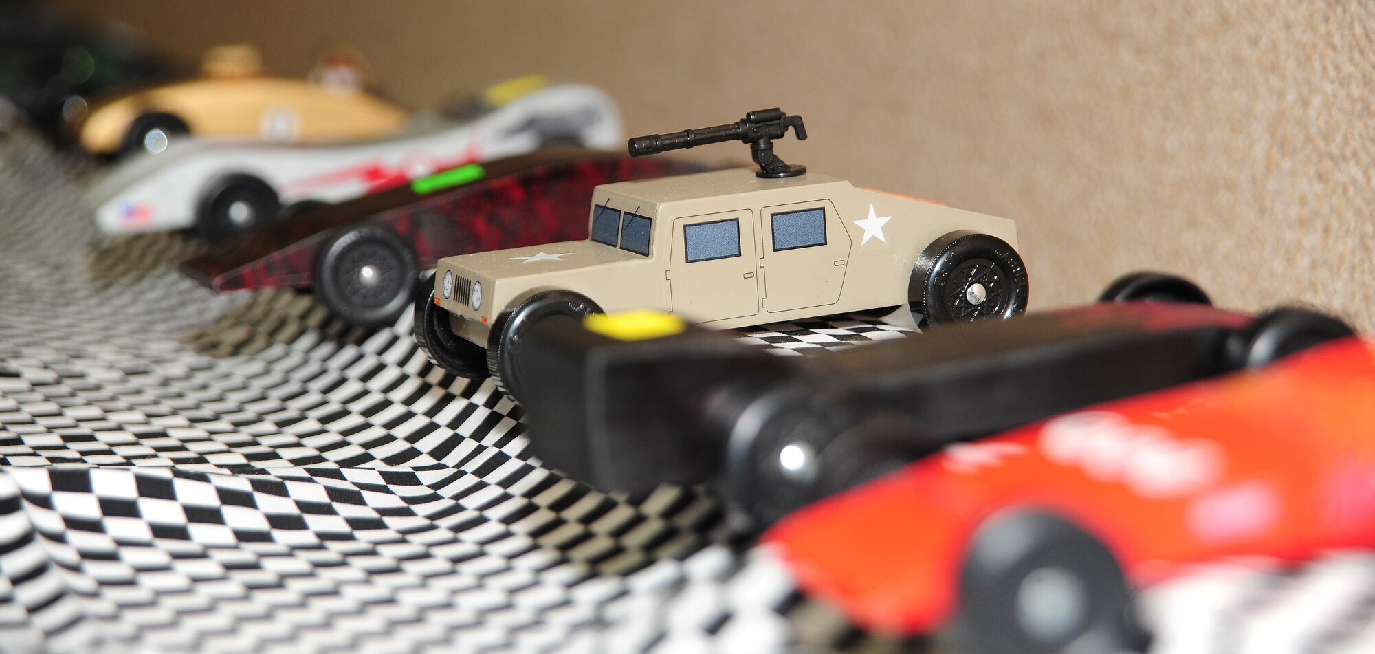WARRENSBURG, Mo. -- Model cars are organized and prepared for a Cub Scout District Pinewood Derby at First United Methodist Church April 14. The cars in the derby were created and designed by 32 Cub Scouts including boys from Whiteman Air Force Base, Knob Noster, Warrensburg and four other cities in the local area. (U.S. Air Force photo/Senior Airman Nick Wilson)