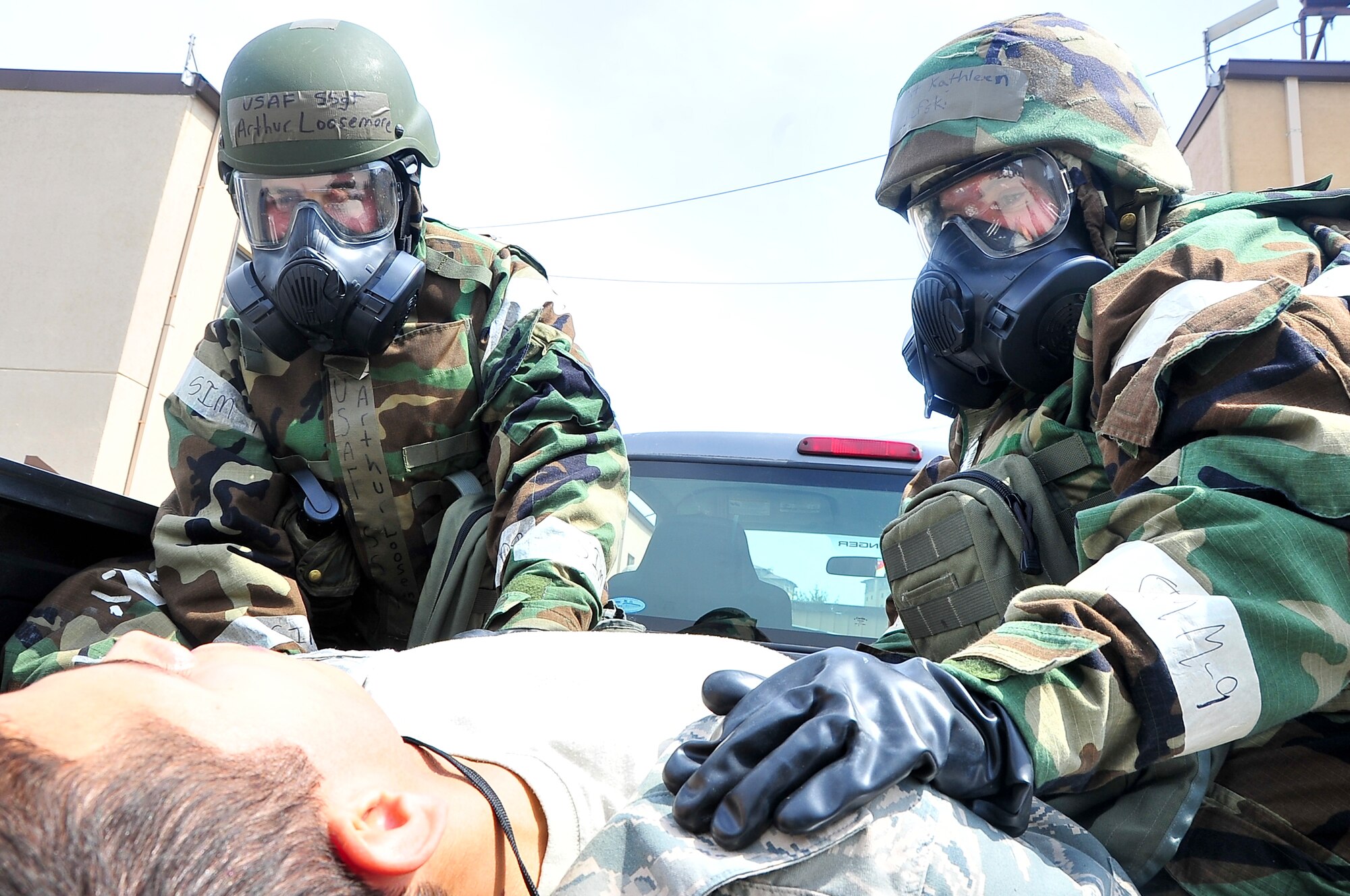 Staff Sgt. Arthur Loosemore (Left), 51st Comptroller Squadron financial analysis, and Staff Sgt. Kathleen Chmielfski, 51st Comptroller Squadron NCOIC of military pay, apply pressure to the simulated wound of a patient during the operational readiness exercise portion of the Consolidated Unit Inspection at Osan Air Base, Republic of Korea, April 24, 2012. PACAF inspectors are here to evaluate the 51st Fighter Wing. (U.S. Air Force photo/Senior Airman Adam Grant)        