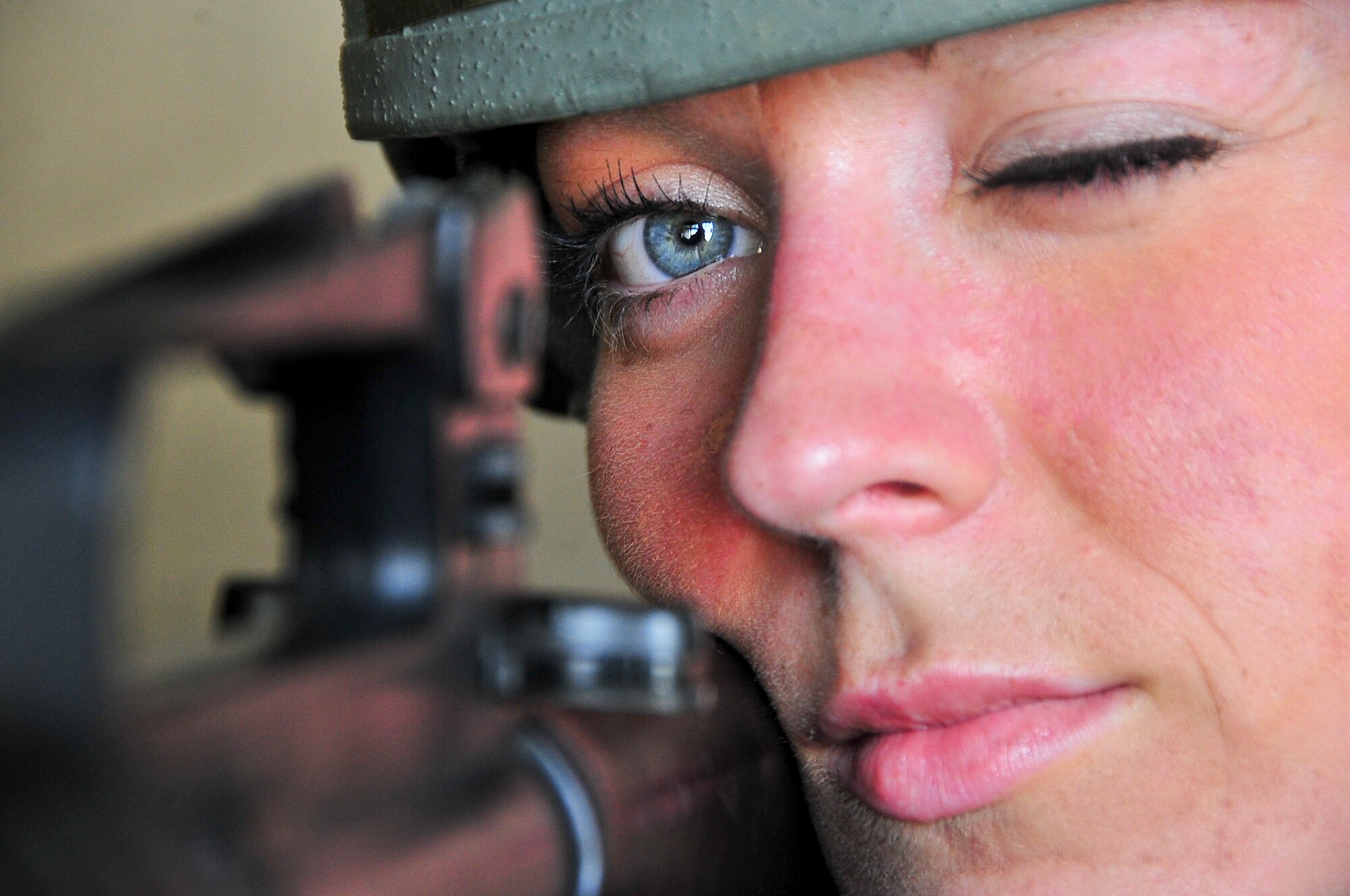 Staff Sgt. Ashley Latham, 51st Dental Squadron dental technician, scans her sector of fire after suspicious activity was spotted during the Consolidated Unit Inspection Osan Air Base, Republic of Korea, April 24, 2012. The CUI aligns inspections during different leadership cycles to check for operational readiness and unit compliance. (U.S. Air Force photo/Senior Airman Adam Grant)
