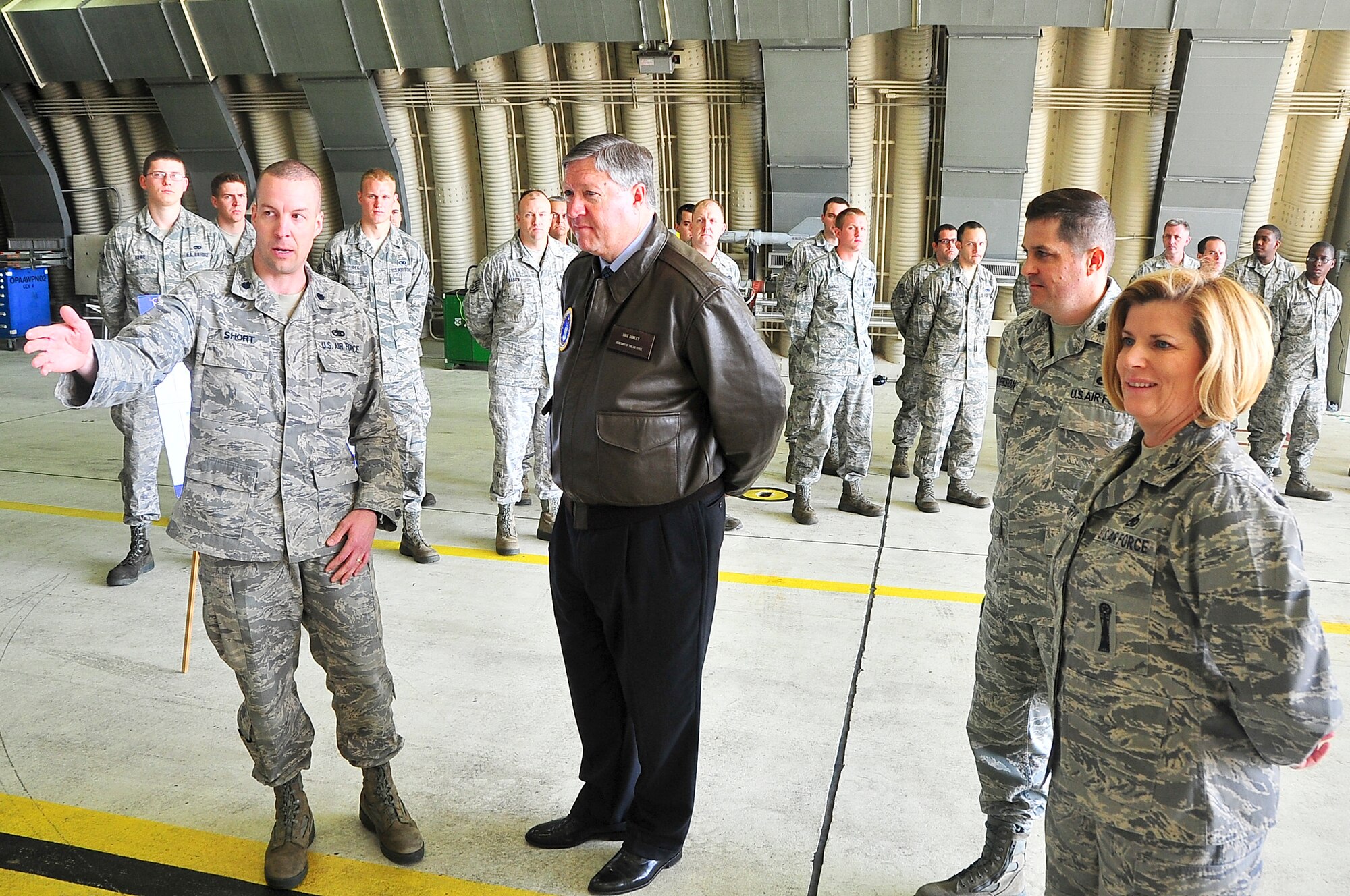 Lt. Col. David Short, (Left) 51st Maintenance Squadron commander, briefs Secretary of the Air Force Michael Donley at Osan Air Base, April 27, 2012.  Donley was briefed on the capabilities the 51st Maintenance Squadron provides to both the 25th and 36th Fighter Squadrons. (U.S. Air Force photo/Senior Airman Adam Grant)