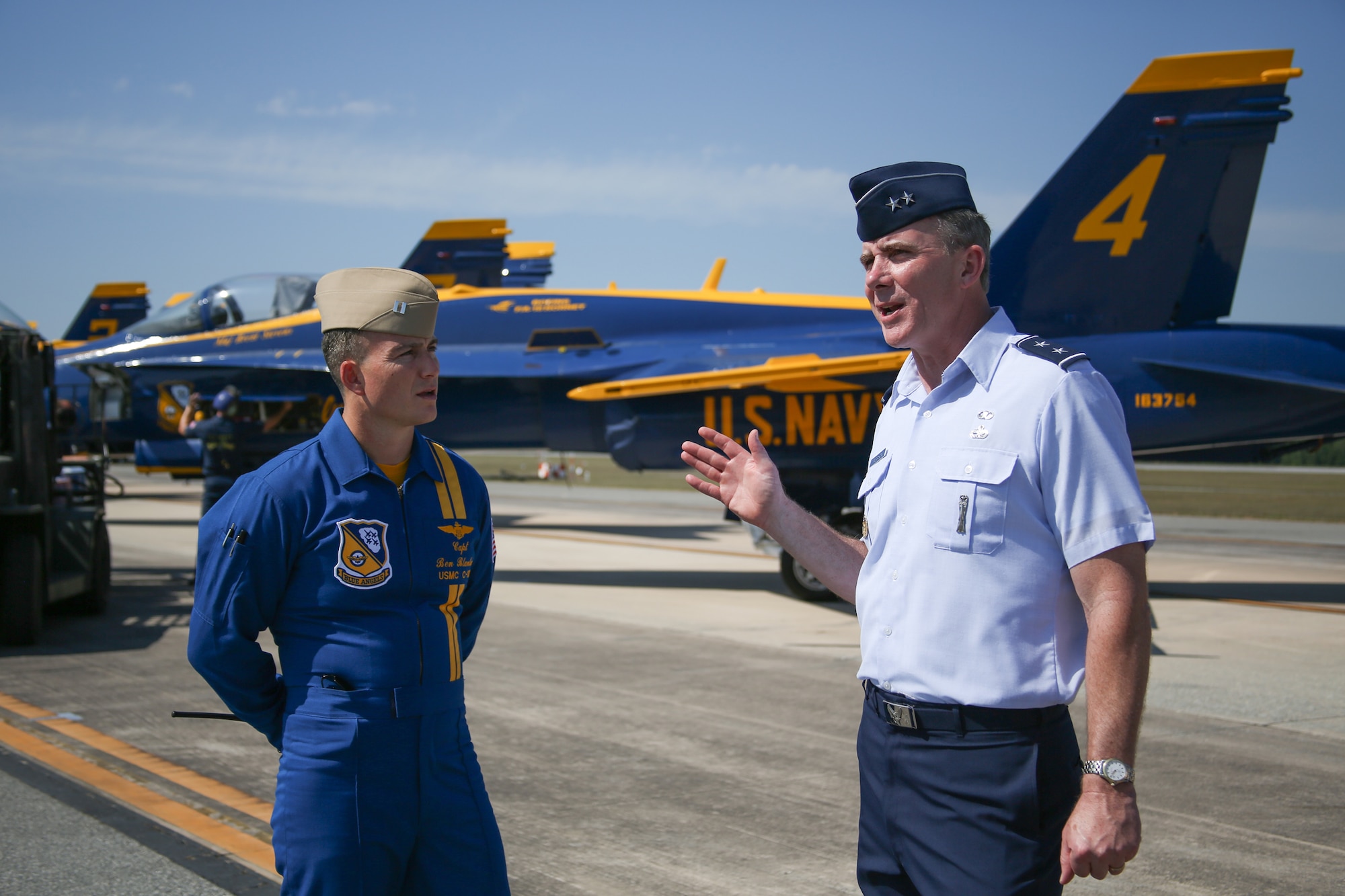Maj. Gen. Robert McMahon, WR-ALC commander, talks with Blue Angels pilot USMC Capt. Benjamon Blanton.  Blanton flies the famous C-130 Fat Albert. (U.S. Air Force photo by 1st Lt. Joel Cooke)