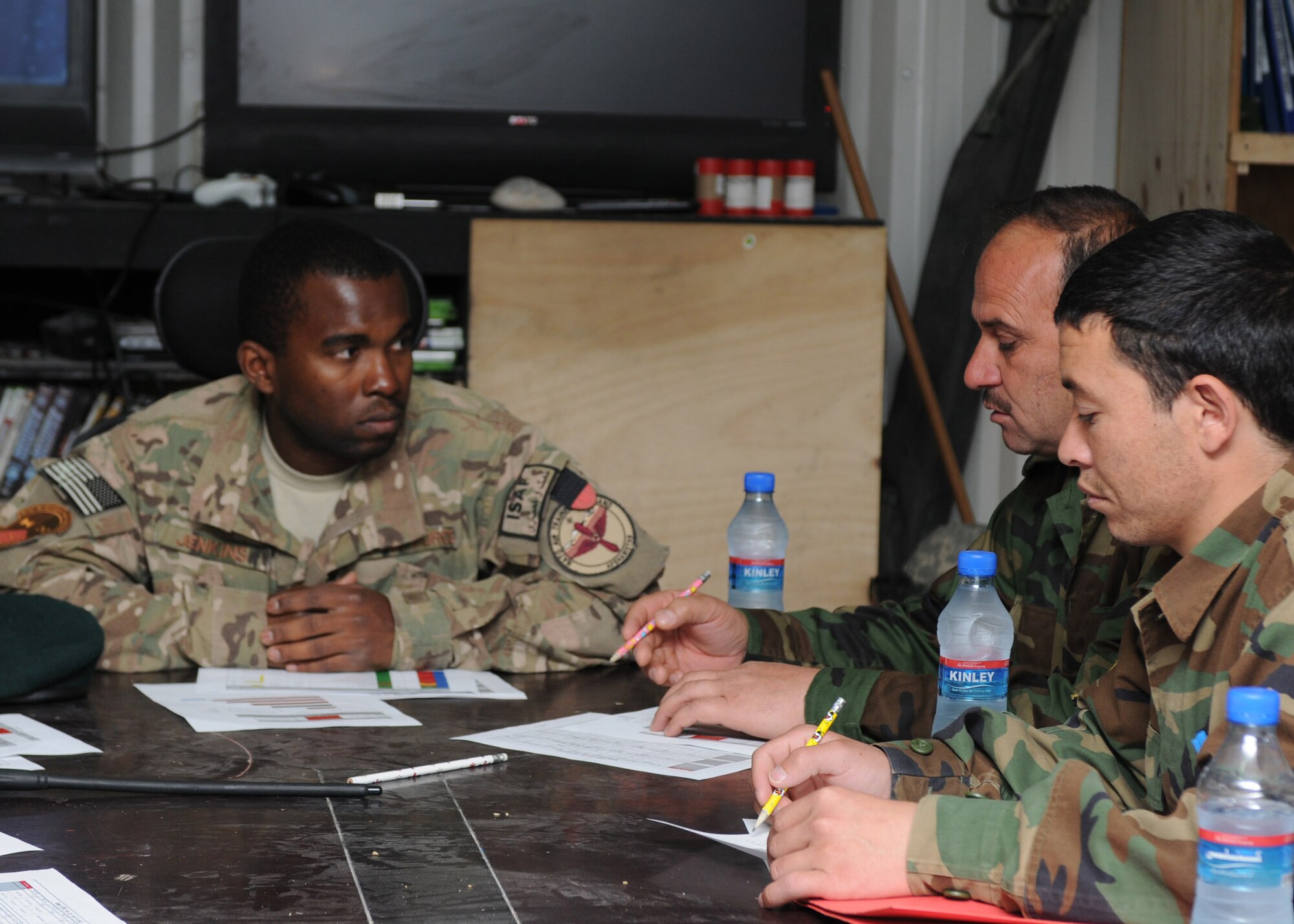 Master Sgt. Charles Jenkins, a plans and scheduling maintenance operations control center and main debrief advisor with the 442nd Air Expeditionary Advisory Squadron, teaches a phase flow management class to Afghan air force maintenance personnel at Kandahar Air Base, Afghanistan, April 17, 2012. The monthly training focused on the importance of basic maintenance fundamentals used to keep aircraft flight worthy. (U.S. Air Force photo by Staff Sgt. Nadine Y. Barclay)