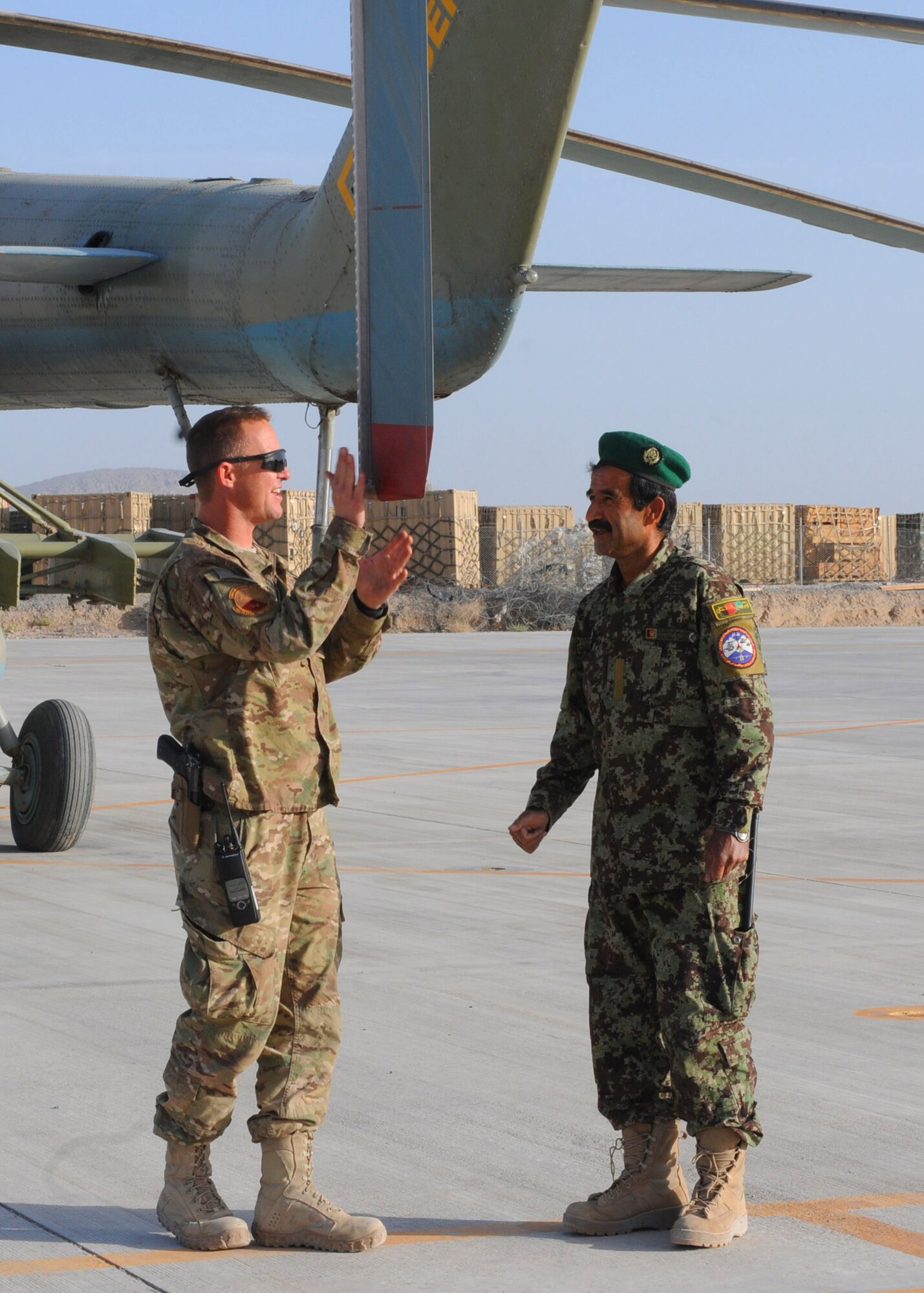 Master Sgt. James Ashcom, an intermediate maintenance section or system advisor with the 442nd Air Expeditionary Advisory Squadron, performs a morning walk-around on an Afghan Mi-17 Helicopter with an AAF airman prior to starting training for the day at Kandahar Air Base, Afghanistan, April 17, 2012. Ashcom is deployed to Kandahar in support of the NATO Training Mission-Afghanistan. (U.S. Air Force photo by Staff Sgt. Nadine Y. Barclay)