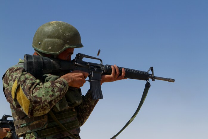 Afghan National Army Pvt. Azetullah, a soldier with 1st Tolai, 1st Kandak, 1st Brigade, 215 Corps, fires his M-16 assault rifle during an Afghan led range April 29, 2012. The range is part of the kandak’s 30-day training academy for new soldiers and is taught by Afghan instructors.
