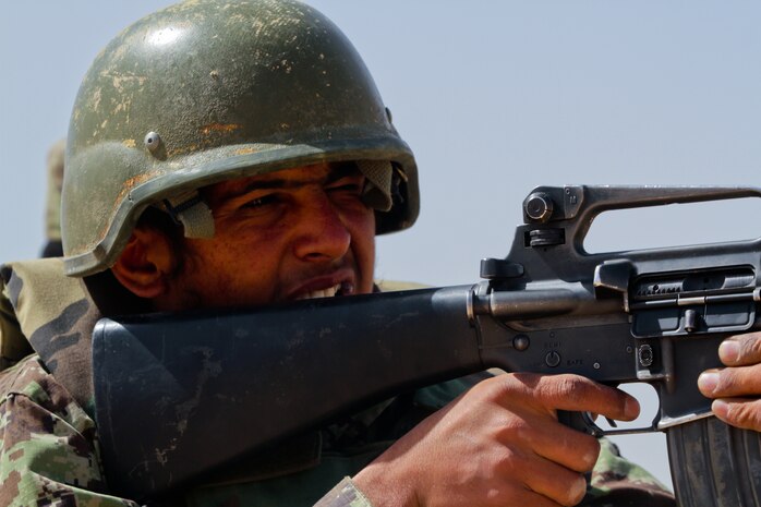 Afghan National Army Pvt. Mohammad Sadaq, Headquarters and Service Tolai, 1st Kandak, 1st Brigade, 215th Corps, fires his M-16 assault rifle during a live-fire range April 29, 2012. Forty-six ANA soldiers shot over the course of three hours as part of the ANA academy 30-day training plan.::r::::n::::r::::n::::r::::n::::r::::n::::r::::n::