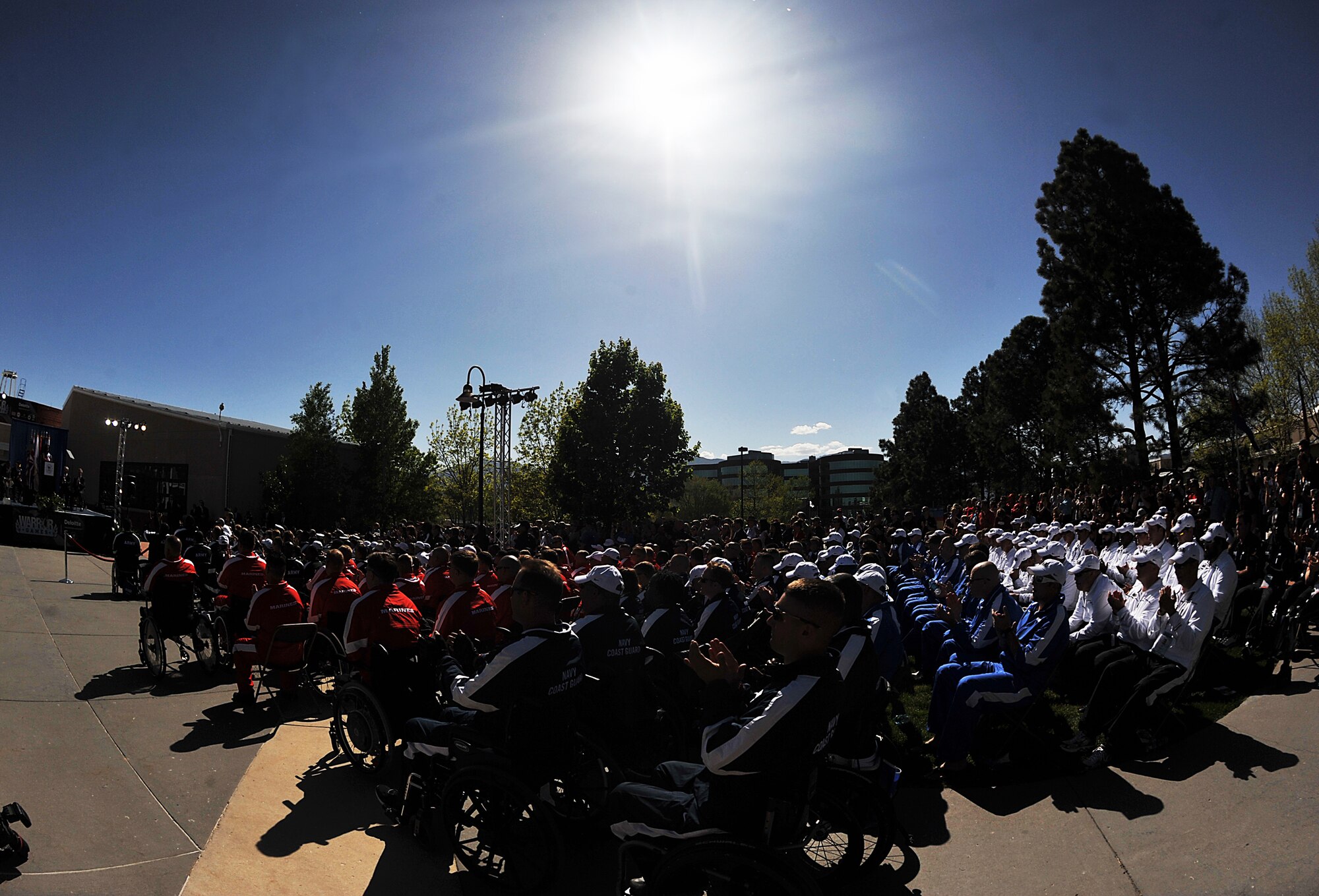 Athletes and the crowd applause as First Lady Michelle Obama, far left, speaks during the opening ceremony of Warrior Games 2012 at Colorado Springs, Colo., May 1, 2012. (U.S. Air Force photo by Val Gempis/Released) 