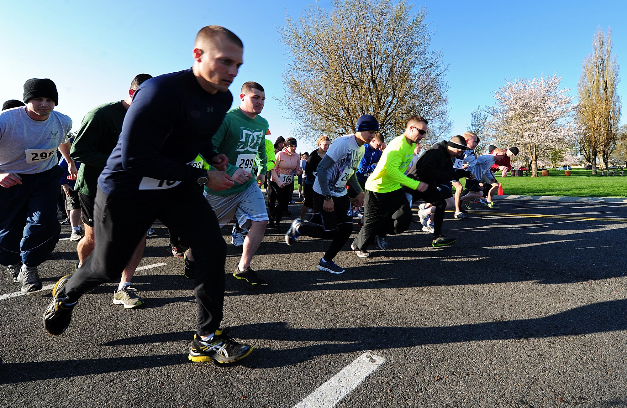 Members of Fairchild dash from the starting line of the “Find Your Stride 5K” at Fairchild Air Force Base, Wash., April 27, 2012. The 5K was a Squadron Team Competition for Commander's Fitness points as well as an individual "Fun Run". The run was open to all Fairchild units, employees and family members. (U.S. Air Force photo by Airman 1st Class Taylor Curry/Released)