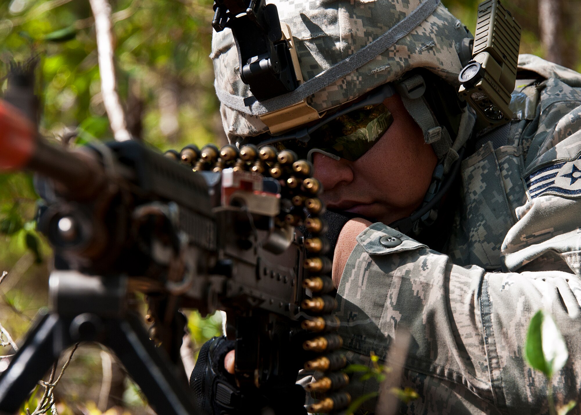 Staff Sgt. Andres Cabral, of the 49th Security Forces Squadron, aims his weapon downrange while waiting for the patrol to move during the three-day Brave Defender field training exercise April 27 at Eglin Air Force Base, Fla.  The exercise is the culmination of Air Force Materiel Command’s six-week security forces deployment training, administered by the 96th Ground Combat Training Squadron. GCTS instructors teach 10 training classes a year, which consists of improvised explosive device detection and reaction, operating in an urban environment, mission planning, land navigation, casualty care and more. More than 100 active-duty and National Guard Airmen attended this training. (U.S. Air Force photo/Samuel King Jr.)