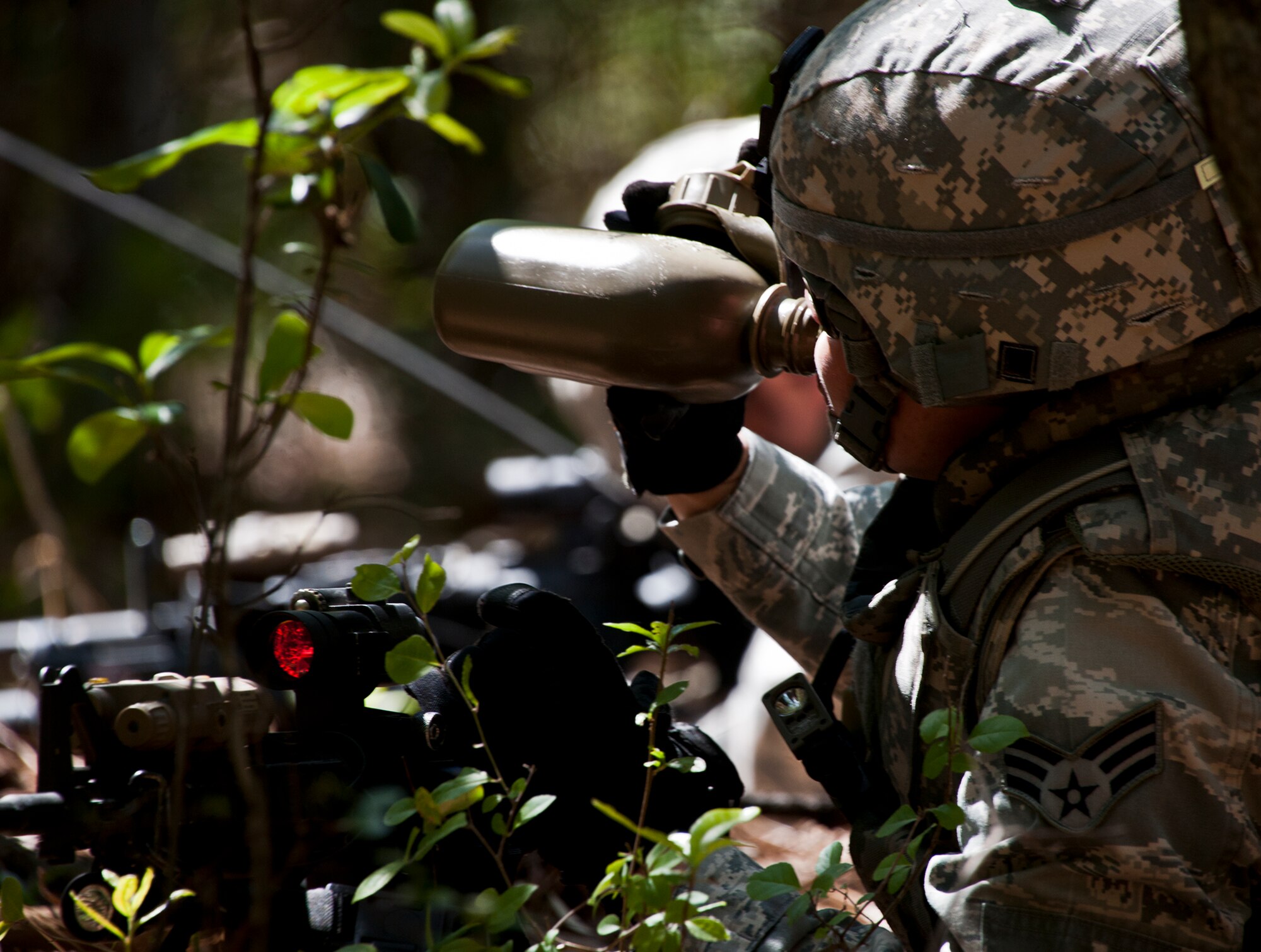 Senior Airman Heather Ignacek, of the 49th Security Forces Squadron, drinks from her canteen during a patrol at the three-day Brave Defender field training exercise April 27 at Eglin Air Force Base, Fla.  The exercise is the culmination of Air Force Materiel Command’s six-week security forces deployment training, administered by the 96th Ground Combat Training Squadron. GCTS instructors teach 10 training classes a year, which consists of improvised explosive device detection and reaction, operating in an urban environment, mission planning, land navigation, casualty care and more. More than 100 active-duty and National Guard Airmen attended this training. (U.S. Air Force photo/Samuel King Jr.)