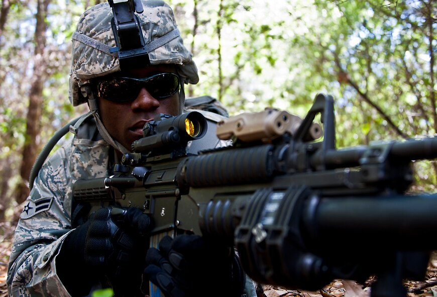 Airman 1st Class Dwayne Martin, of the 49th Security Forces Squadron, scans his field of fire while on patrol during the three-day Brave Defender field training exercise April 27 at Eglin Air Force Base, Fla. The exercise is the culmination of Air Force Materiel Command’s six-week security forces deployment training, administered by the 96th Ground Combat Training Squadron. GCTS instructors teach 10 training classes a year, which consists of improvised explosive device detection and reaction, operating in an urban environment, mission planning, land navigation, casualty care and more. More than 100 active-duty and National Guard Airmen attended this training. (U.S. Air Force photo/Samuel King Jr.)