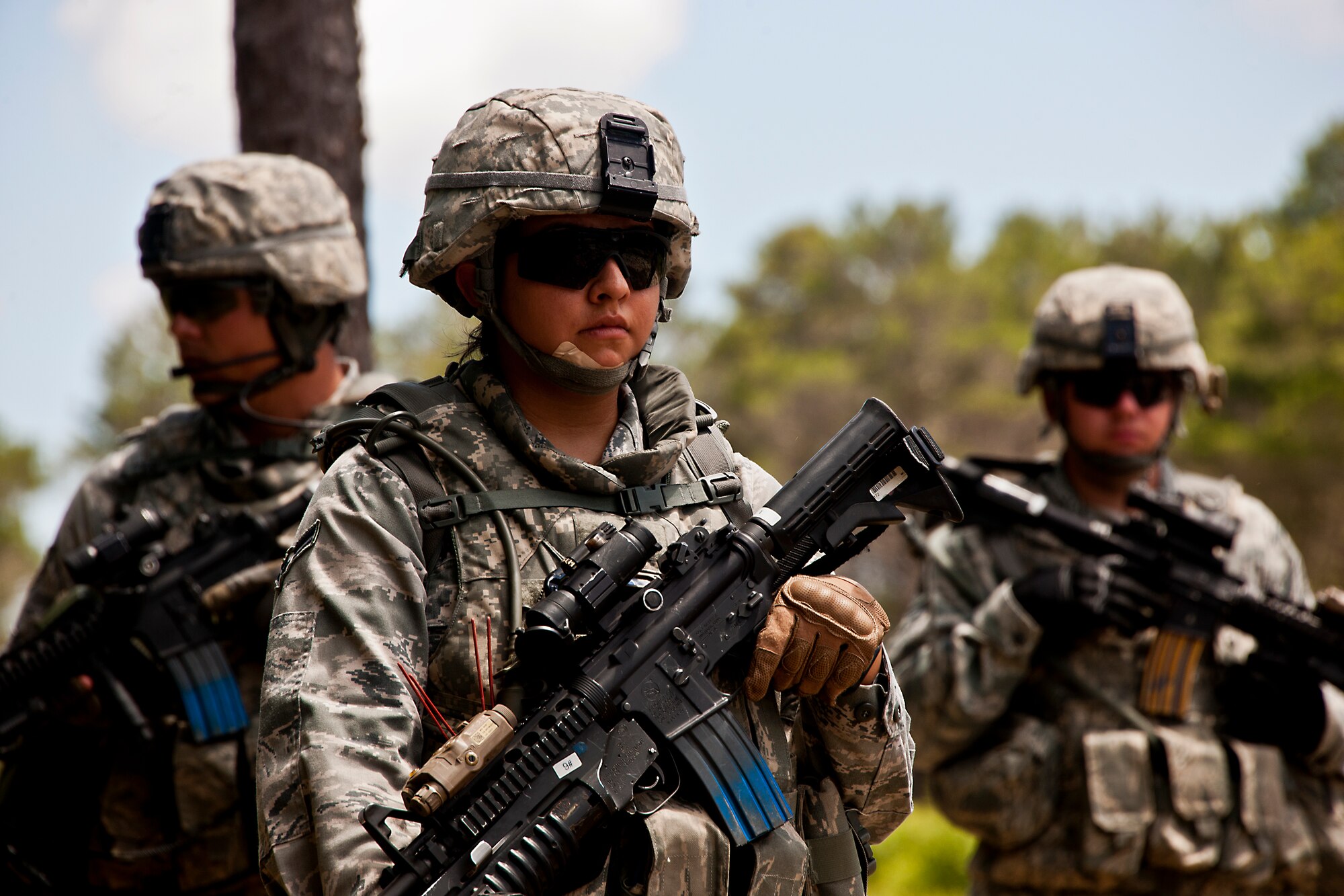 Airman 1st Class LaSondra Arredondo, of the 49th Security Forces Squadron, and her squad wait to go outside the wire on patrol during the three-day Brave Defender field training exercise April 27 at Eglin Air Force Base, Fla.  The exercise is the culmination of Air Force Materiel Command’s six-week security forces deployment training, administered by the 96th Ground Combat Training Squadron. GCTS instructors teach 10 training classes a year, which consists of improvised explosive device detection and reaction, operating in an urban environment, mission planning, land navigation, casualty care and more. More than 100 active-duty and National Guard Airmen attended this training. (U.S. Air Force photo/Samuel King Jr.)