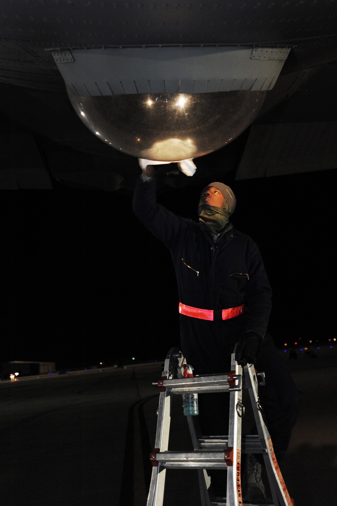 U.S. Air Force Airman 1st Class William Ellis, 27th Special Operations Aircraft Maintenance Squadron crew chief, wipes down a loadmasters view-bubble on an AC-130H Spectre on the flightline at Cannon Air Force Base, N.M., Feb. 21, 2012. Small tasks, such as maintaining aircraft cleanliness, are critical in eliminating even the smallest possibility for error on missions. (U.S. Air Force photo by Senior Airman Jette Carr)  