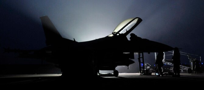 Two U.S. Air Force Airmen perform maintenance on an F-16 Fighting Falcon aircraft May 01, 2012 at Misawa Air Base, Japan. Just like the F-16s they maintain, Misawa's Airmen perform their duty in all weather conditions at all hours of the day. (U.S. Air Force photo by Tech. Sgt. Phillip Butterfield/Released)