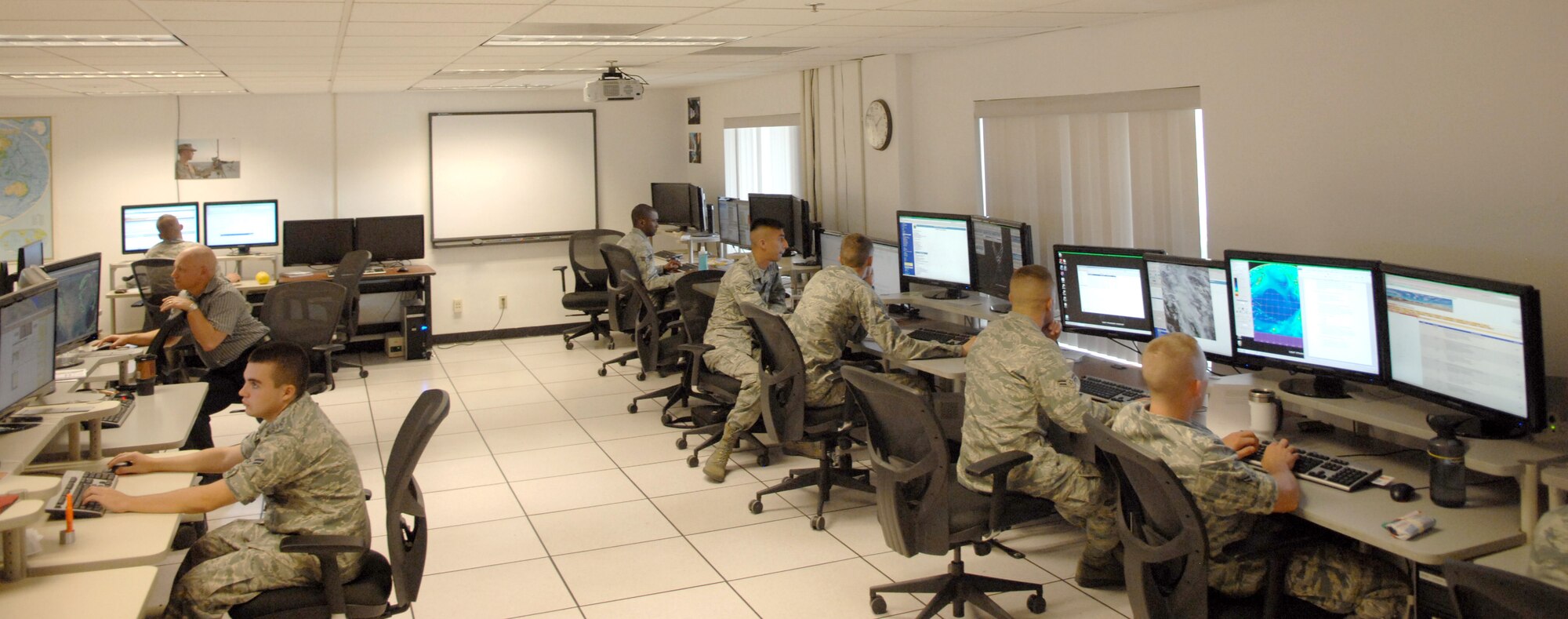 U.S. Air Force Airmen of the 25th Operational Weather Squadron, are partaking in a class to sharpen their forecasting skills on Davis-Monthan Air Force Base, Ariz., April 25, 2012. The class is taught by two retired weather forecasters, a former master sergeant and Senior master sergeant. (U.S. Air Force photo by Airman 1st Class Josh Slavin/Released)

