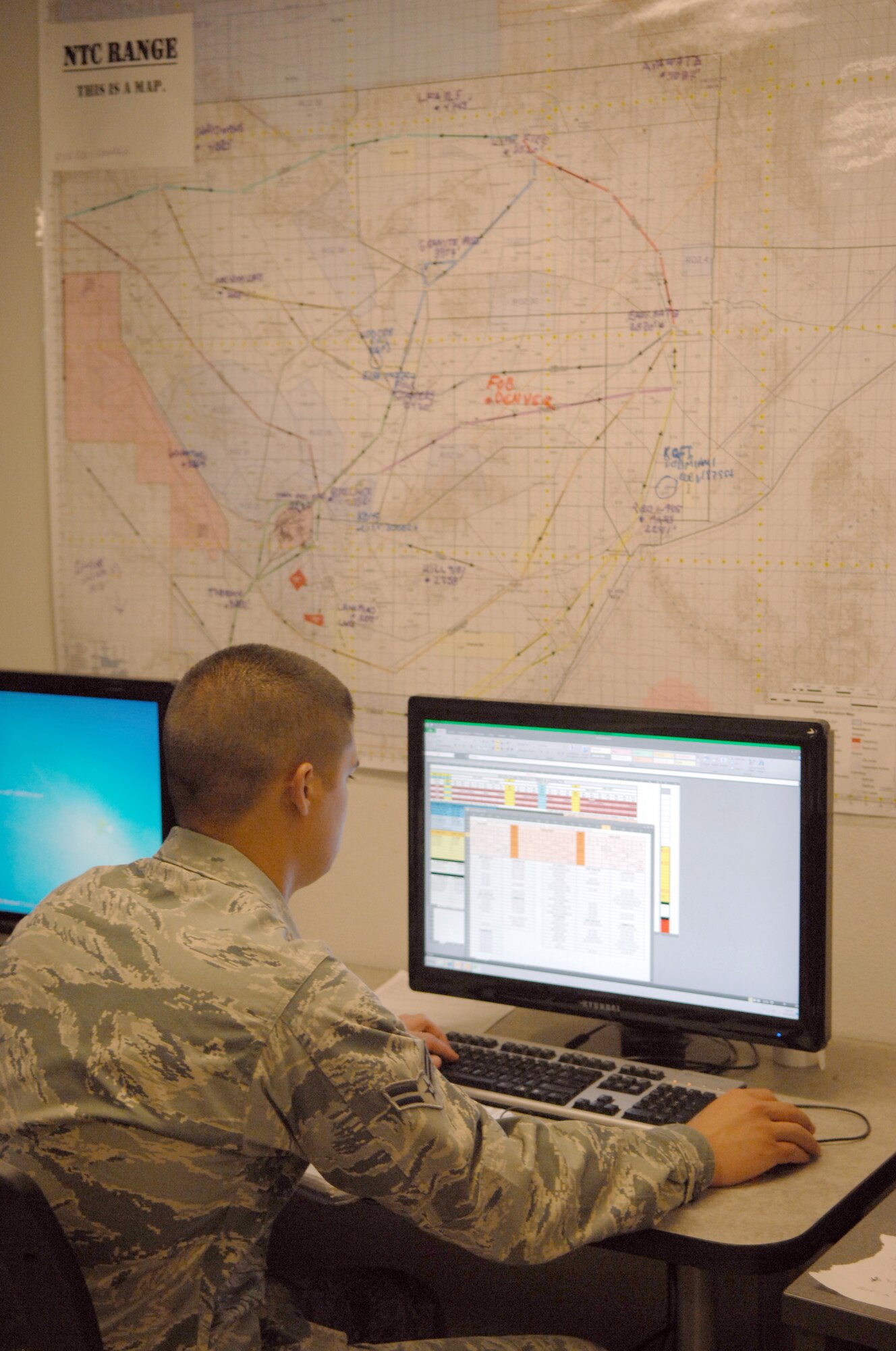 U.S. Air Force Airman 1st Class Wesley Pope, weather forcaster, works on administrative tasks on Davis-Monthan Air Force Base, Ariz., April 25, 2012. Pope is a forcaster for south-western states. (U.S. Air Force photo by Airman 1st Class Josh Slavin/Released)