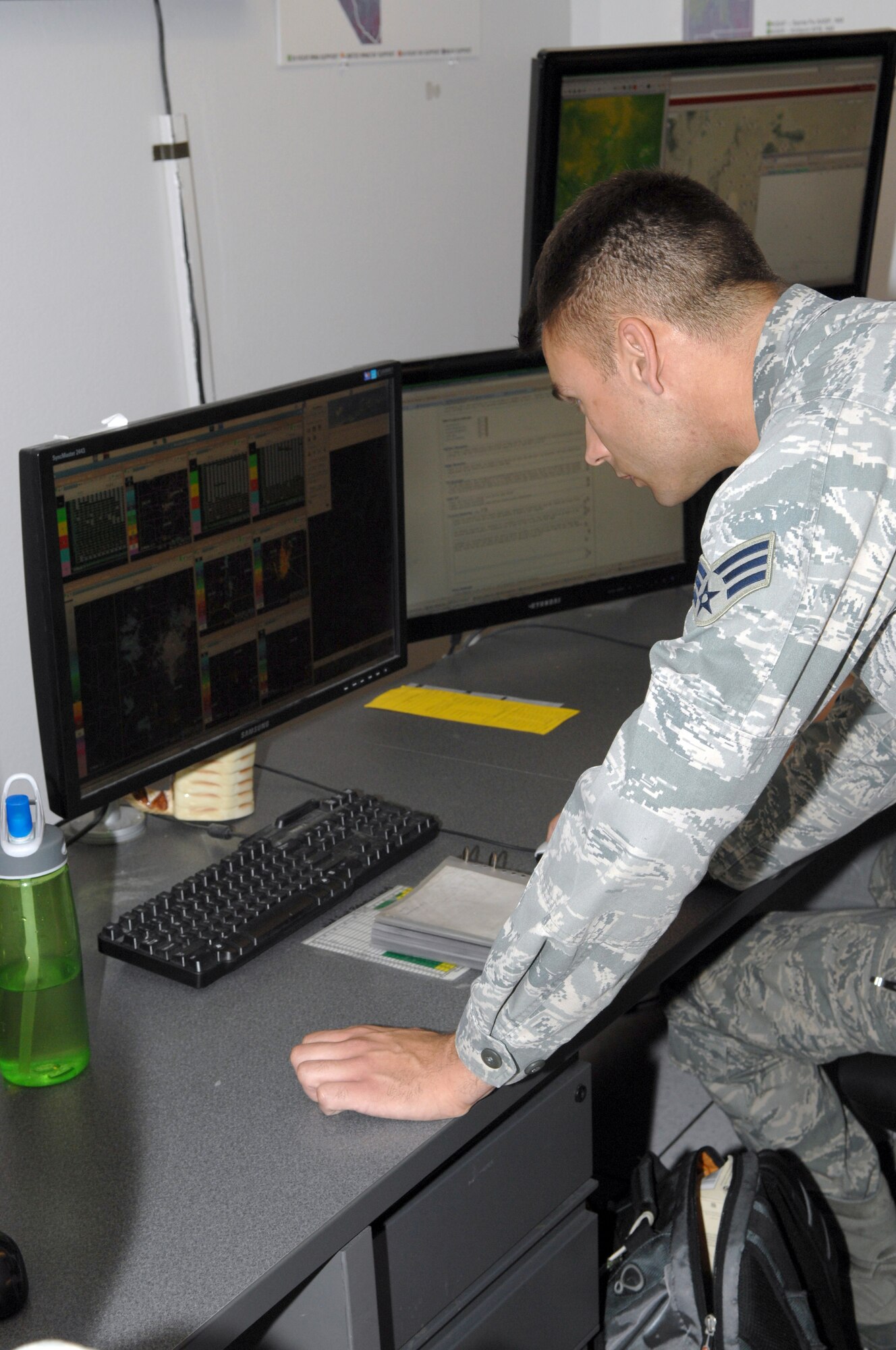 U.S. Air Force Senior Airman Philip Shumaker, 25th Operational Weather Squadron weather forecaster, is looking at radar imagery on one of our Open Principle User Processor computers on Davis-Monthan Air Force Base, Ariz., April 25, 2012. Shumaker is also acting as a zone supervisor for south-western states. (U.S. Air Force photo by Airman 1st Class Josh Slavin/ Released)