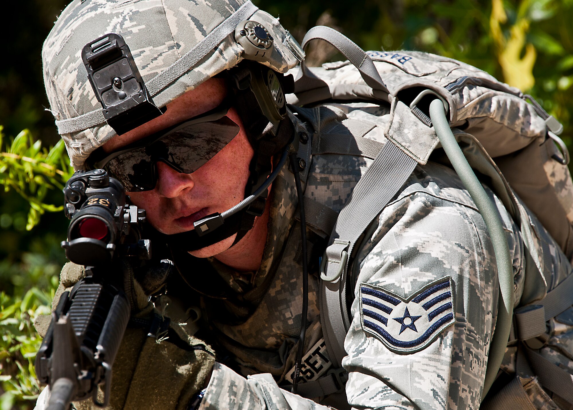 Staff Sgt. Tyler Bassett, a guardsman from the 114th Security Forces Squadron, watches the six o’clock of his patrol during the first counter-insurgency operation of the three-day Brave Defender field training exercise April 26 at Eglin Air Force Base, Fla.  The exercise is the culmination of Air Force Materiel Command’s six-week security forces deployment training, administered by the 96th Ground Combat Training Squadron. GCTS instructors teach 10 training classes a year, which consists of improvised explosive device detection and reaction, operating in an urban environment, mission planning, land navigation casualty care and more. More than 100 active-duty and National Guard Airmen attended this training. (U.S. Air Force photo/Samuel King Jr.)