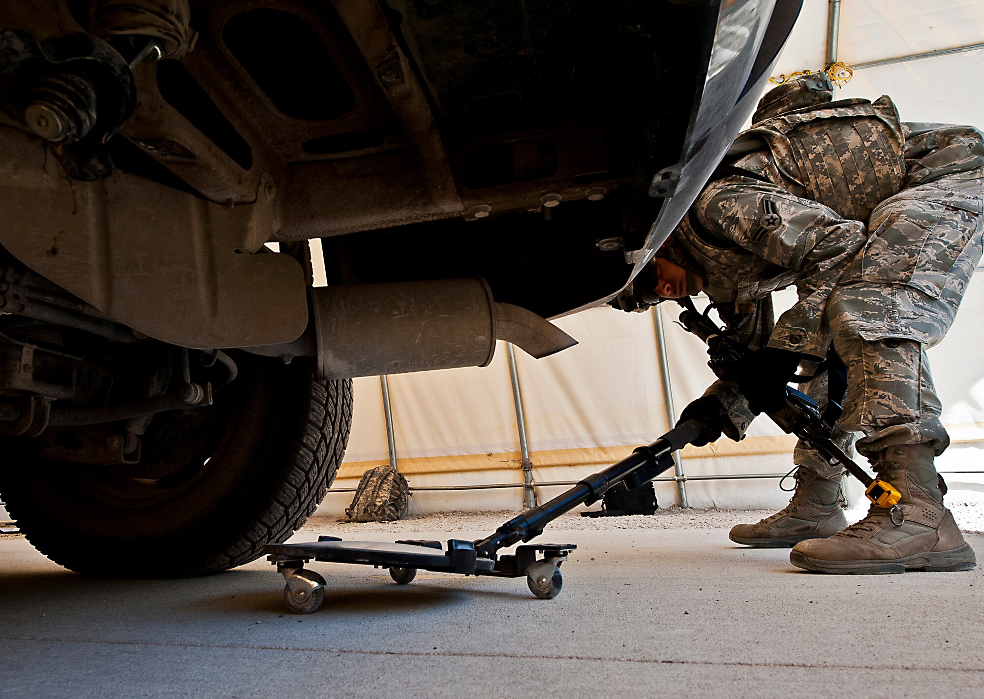 Airman 1st Class Aaron Williams, of the 802nd Security Forces Squadron, checks the undercarriage of the vehicle for suspicious materials during an inspection at the three-day Brave Defender field training exercise April 26 at Eglin Air Force Base, Fla.  The exercise is the culmination of Air Force Materiel Command’s six-week security forces deployment training, administered by the 96th Ground Combat Training Squadron. GCTS instructors teach 10 training classes a year, which consists of improvised explosive device detection and reaction, operating in an urban environment, mission planning, land navigation, casualty care and more. More than 100 active-duty and National Guard Airmen attended this training. (U.S. Air Force photo/Samuel King Jr.)
Staff 
