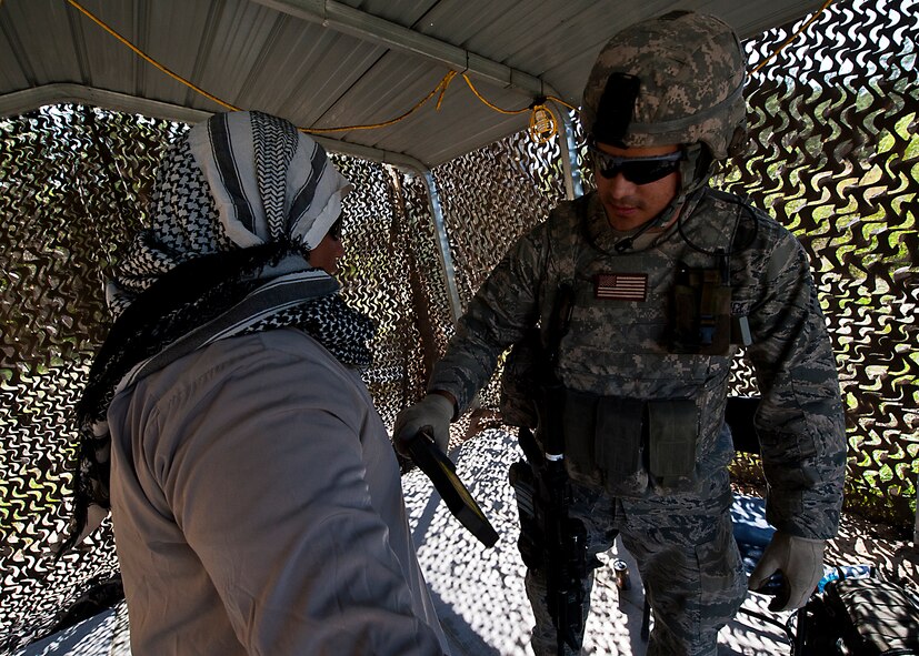 A senior airman checks a camp visitor for weapons at one of the entry control points during the three-day Brave Defender field training exercise April 26 at Eglin Air Force Base, Fla.  The exercise is the culmination of Air Force Materiel Command’s six-week security forces deployment training, administered by the 96th Ground Combat Training Squadron. GCTS instructors teach 10 training classes a year, which consists of improvised explosive device detection and reaction, operating in an urban environment, mission planning, land navigation, casualty care and more. More than 100 active-duty and National Guard Airmen attended this training. (U.S. Air Force photo/Samuel King Jr.)