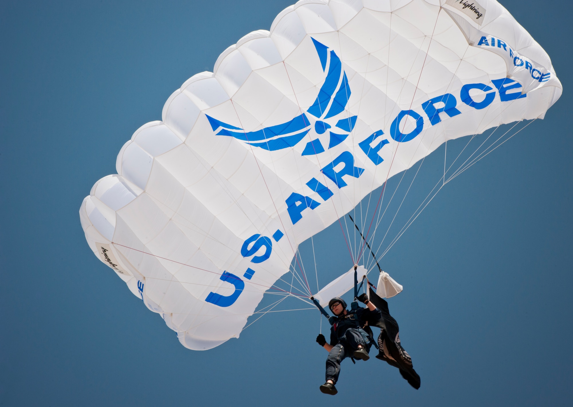 A member of the Air Force Academy Wings of Blue parachute jump team performs during the Dyess Big Country Airfest April 28, 2012, at Dyess Air Force Base, Texas. Along with the performance of Wings of Blue, the airfest also showcased a B-2 Spirit, A-10 Thunderbolt, P-47 Thunderbolt, MiG-17 and many more aircraft. (U.S. Air Force photo by Airman 1st Class Jonathan Stefanko/ Released)