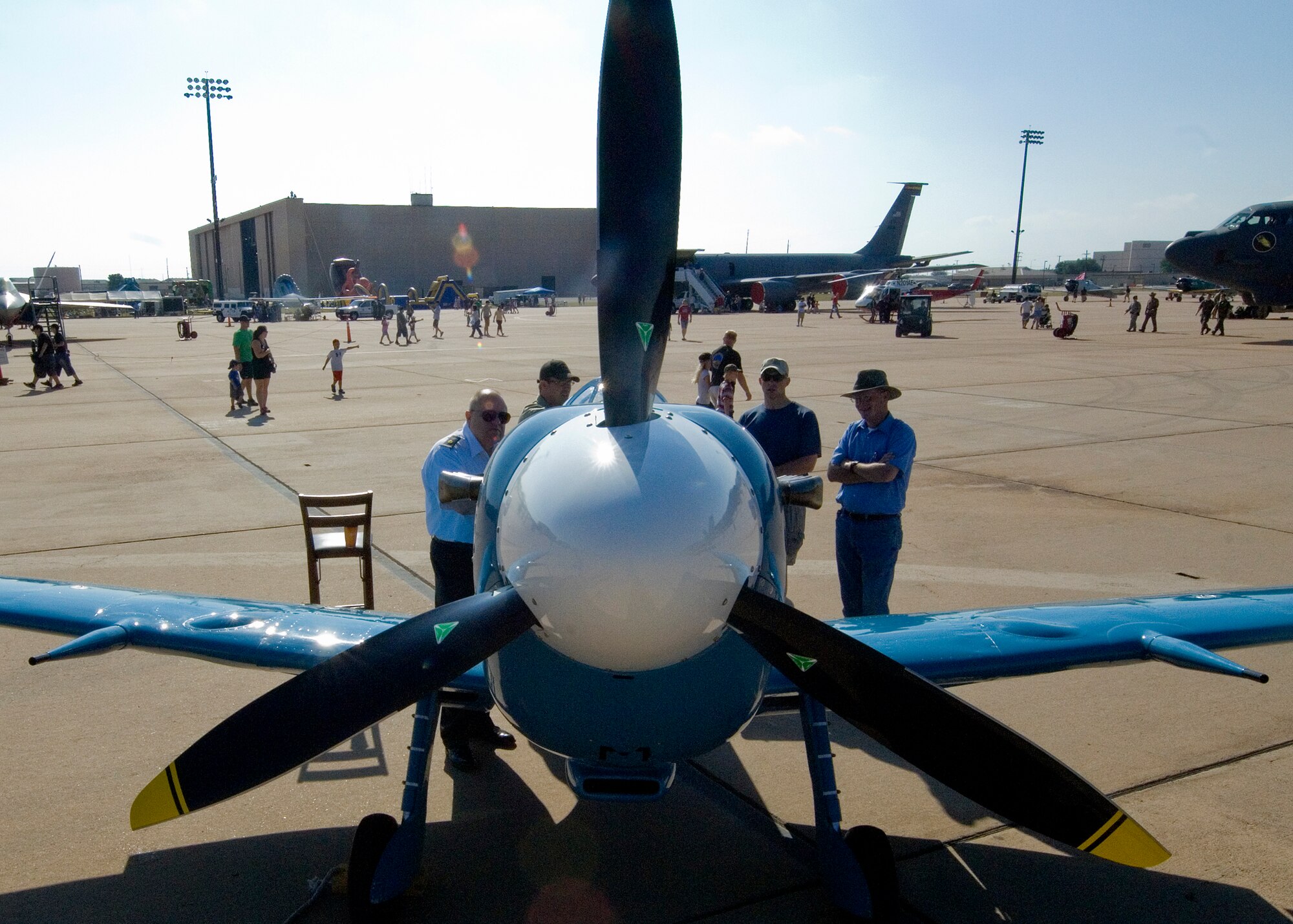 Spectators admire a Supermarine Spitfire during the Dyess Big Country Airfest April 28, 2012, at Dyess Air Force Base, Texas. The airfest included many World War II aircraft including the B-17 Flying Fortress, B-25 Mitchell and Mitsubishi A6M Zero. (U.S. Air Force photo by Airman 1st Class Damon Kasberg/Released)