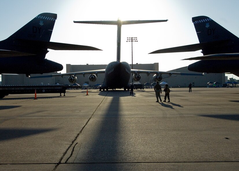 Volunteers walk towards a static display of a C-17 during the Dyess Big Country Airfest April 28, 2012, at Dyess Air Force Base, Texas.  The airfest featured over 30 aircraft, including the B-1B Lancer, B-2 Spirit, C-130 Hercules, A-10 Thuderbolt II, F-22 Raptor and KC-135 Stratotanker in front of an estimated 30,000 guests. (U.S. Air Force photo by Airman 1st Class Damon Kasberg/Released)