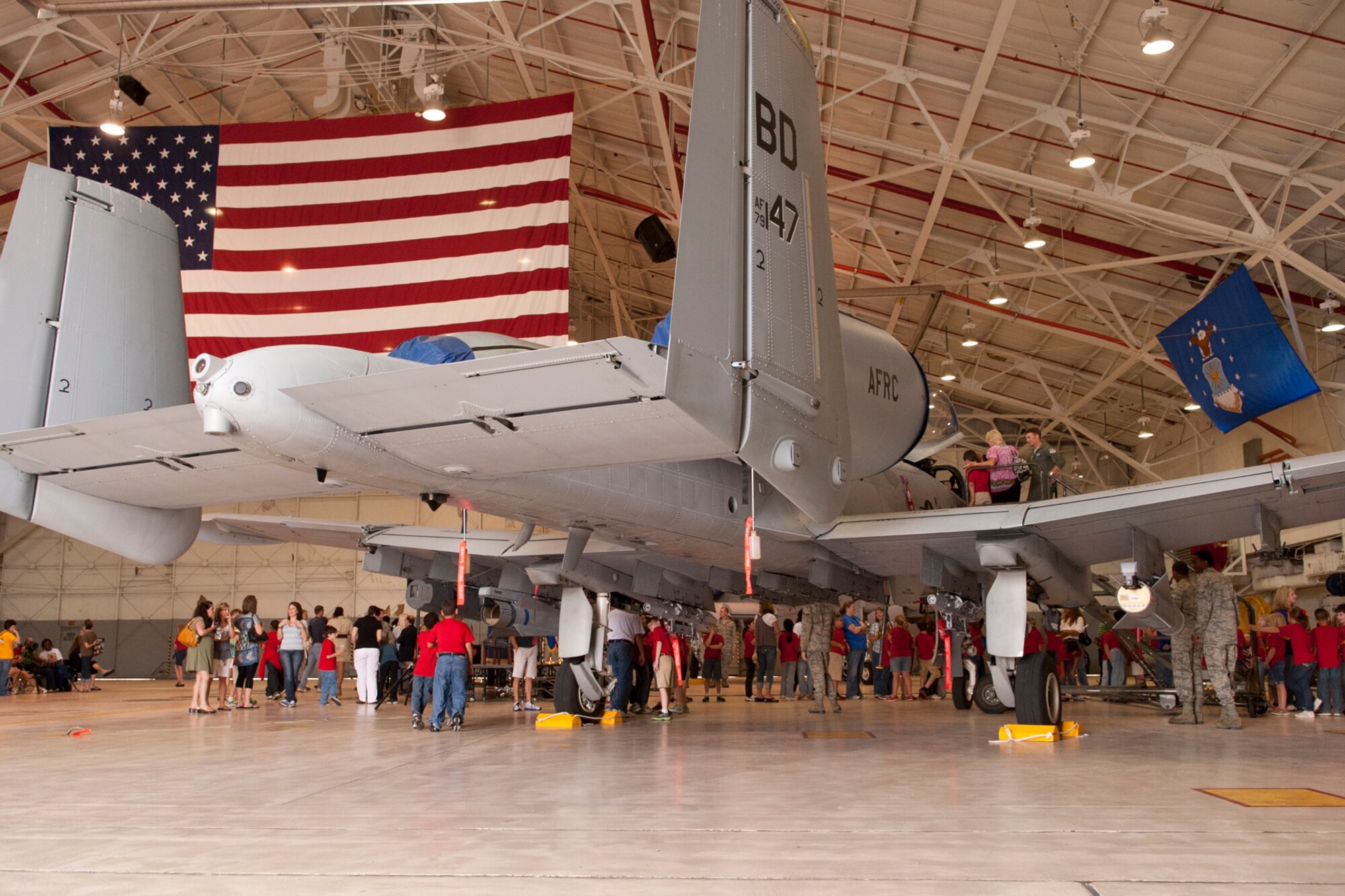 Students, parents and faculty from the Phoenix Magnet Elementary School from Alexandria, La., get a tour of a 917th Fighter Group A-10 Thunderbolt II following the retirement ceremony for Senior Master Sgt. Margaret Maffett, Barksdale Air Force Base, La., April 27, 2012. Maffett is a teacher at Phoenix Magnet, and the students sent care packages and letters to members of the 917th Fighter Group during their recent deployment to Afghanistan. (U.S. Air Force photo by Master Sgt. Greg Steele/Released)