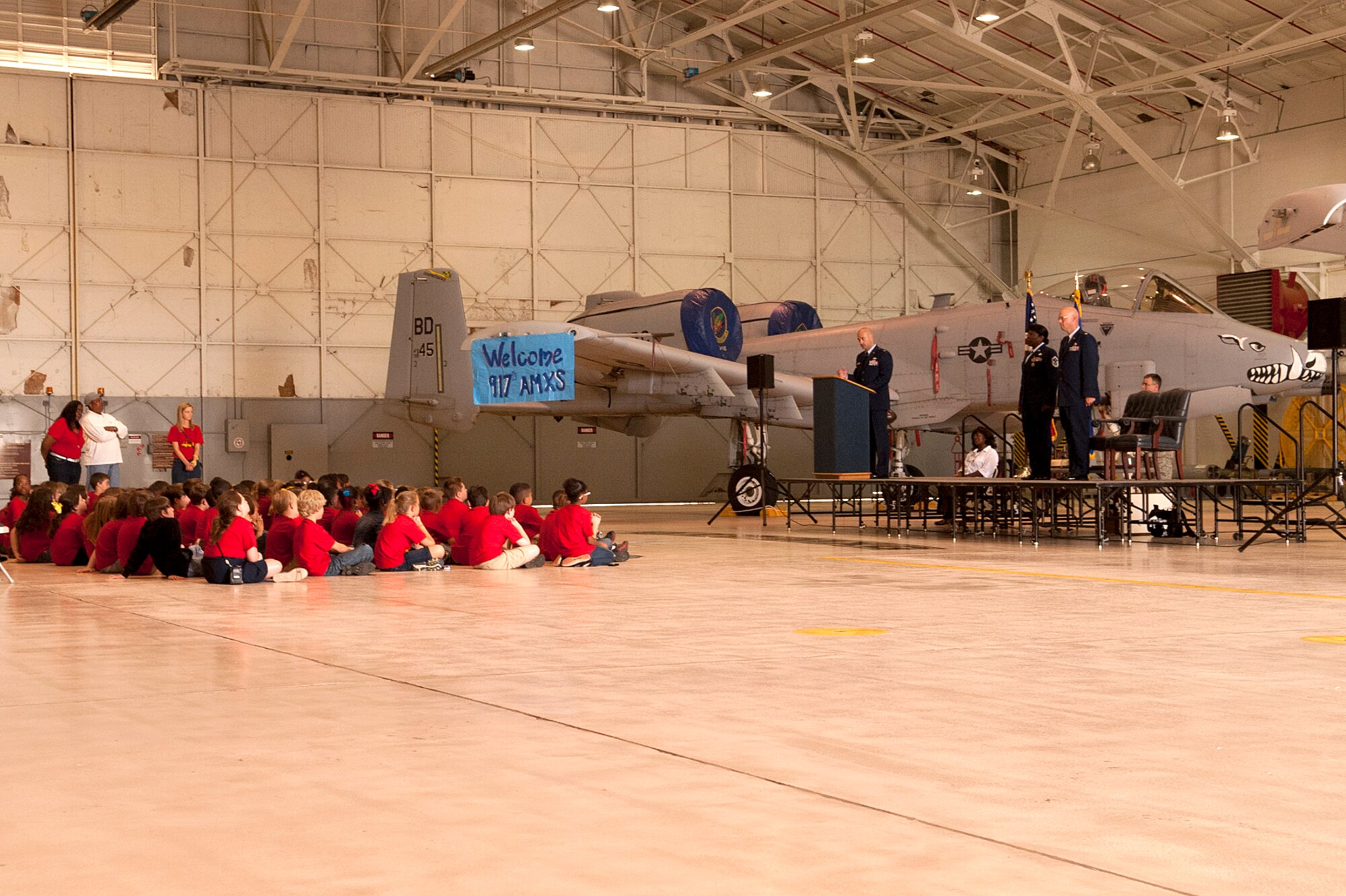 Students, parents and faculty from the Phoenix Magnet Elementary School, attend the retirement ceremony for U.S. Air Force Senior Master Sgt. Margaret Maffett, 917th Aircraft Maintenance Squadron first sergeant, Barksdale Air Force Base, La., April 27, 2012. Maffett, a teacher at Phoenix Magnet, is retiring from the Air Force Reserve after more than 30 years of service. (U.S. Air Force photo by Master Sgt. Greg Steele/Released)