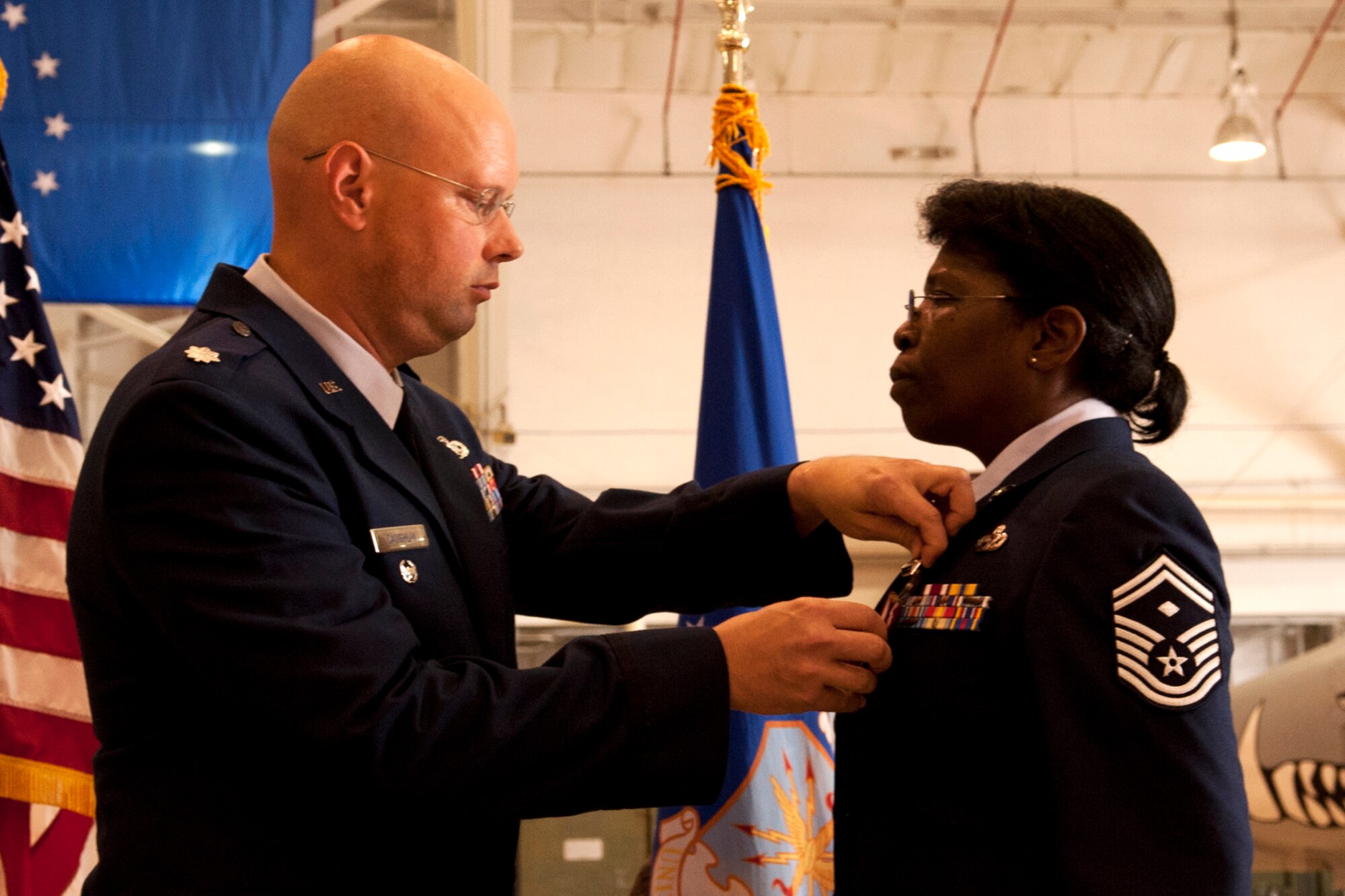 U.S. Air Force Lt. Col. Travis Caughlin, 917th Fighter Group deputy commander for maintenance, presents the Meritorious Service Medal to Senior Master Sgt. Margaret Maffett, 917th Aircraft Maintenance Squadron first sergeant, during a retirement ceremony, Barksdale Air Force Base, La., April 27, 2012. Maffett is retiring from the Air Force Reserve after more than 30 years of service. (U.S. Air Force photo by Master Sgt. Greg Steele/Released)